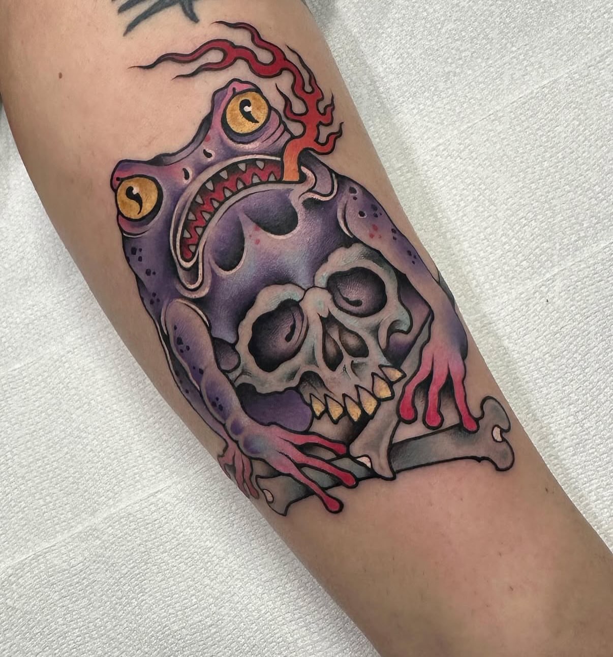Frog skull hybrid American traditional tattoo on the forearm by Mark Boller