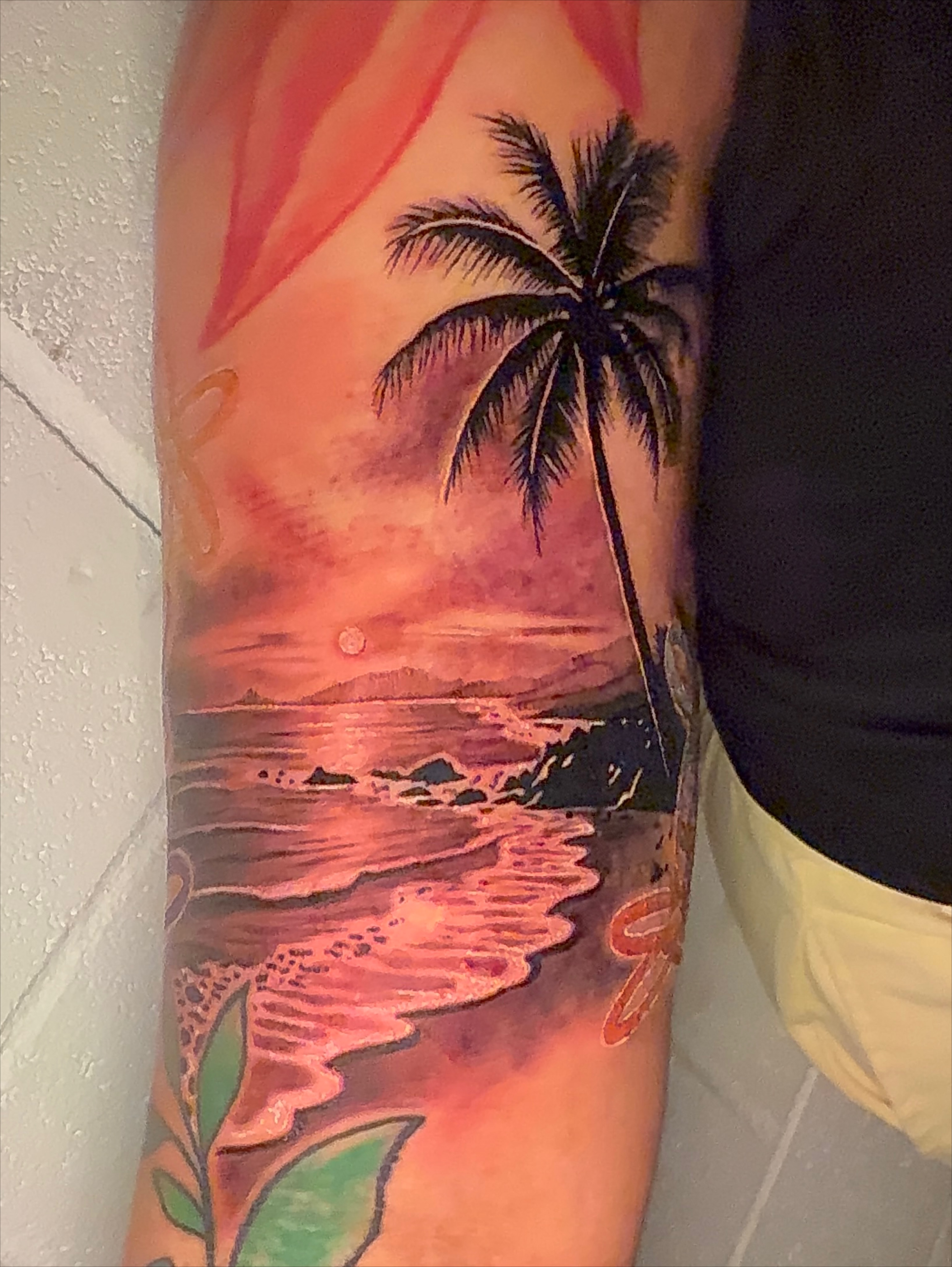 Sunset beach watercolor tattoo on the forearm by Svetlana