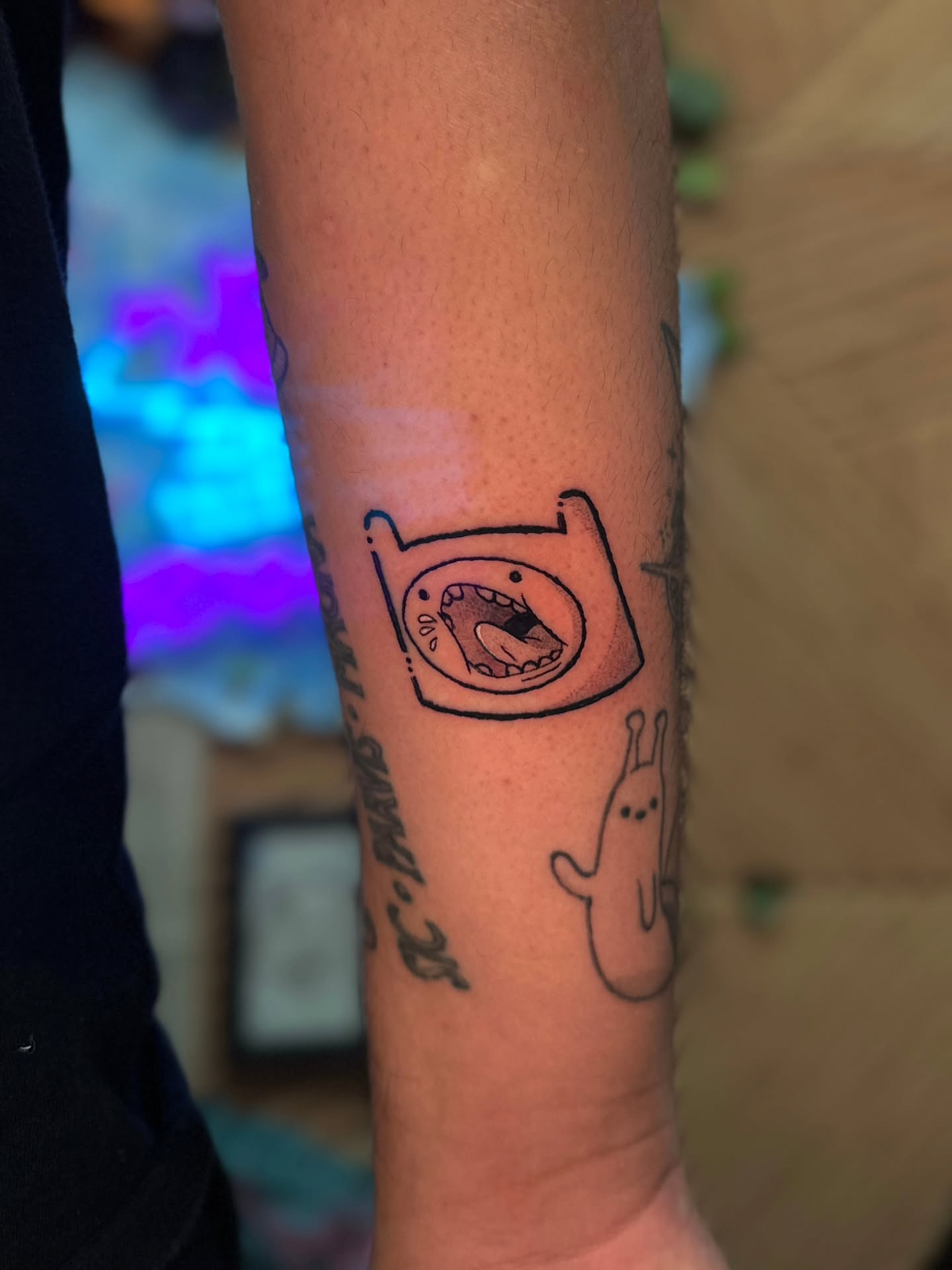 Adventure Time characters dotwork tattoo on the forearm by Benjamin Frost