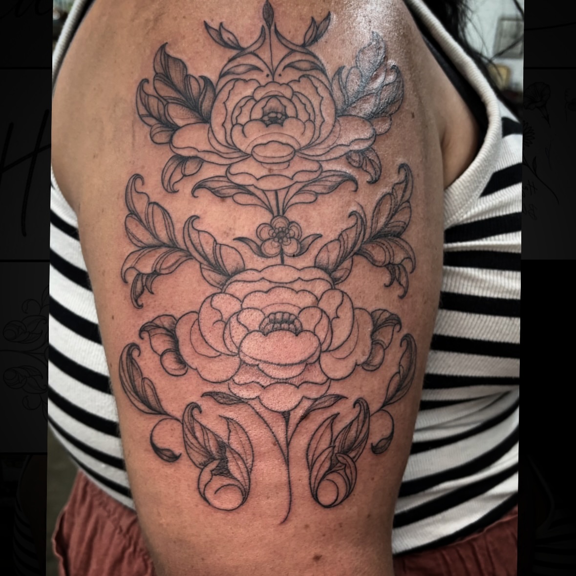 Peony flowers black and grey tattoo on the upper arm by Caitlin Curtis Tattoos & Booking, Dayton, Ohio