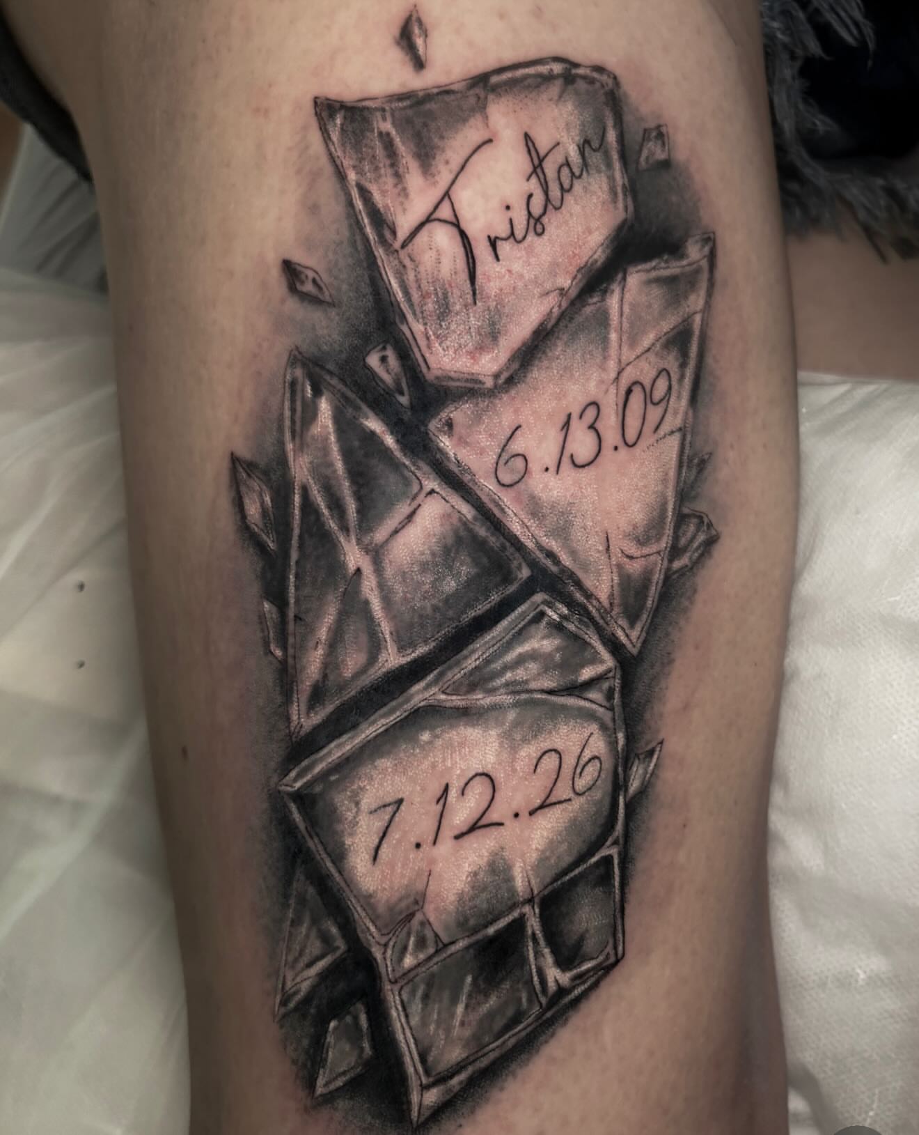Broken glass black and grey tattoo on the forearm by Sal