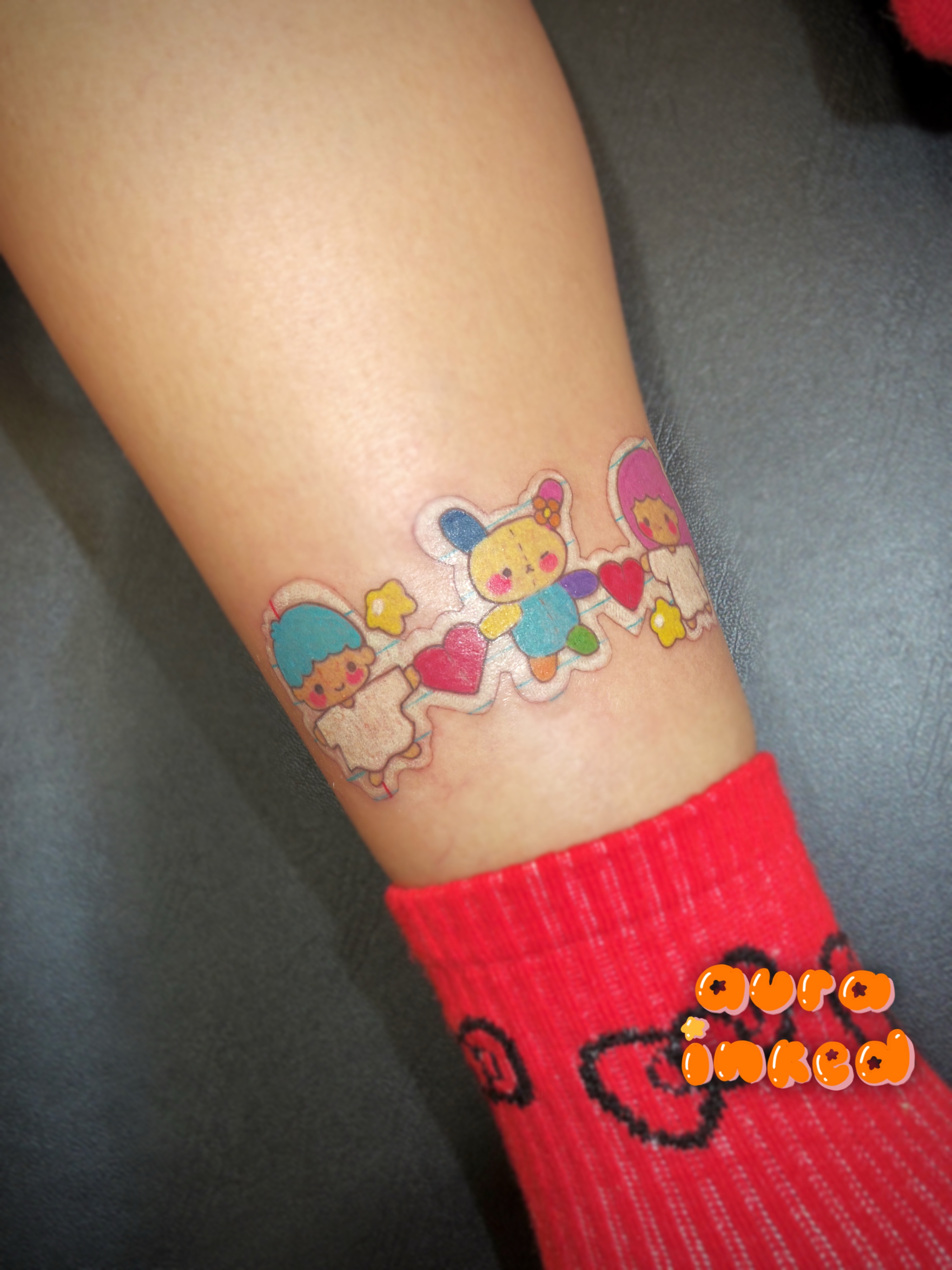 Kawaii characters illustrative tattoo on the forearm by Delly ⌯