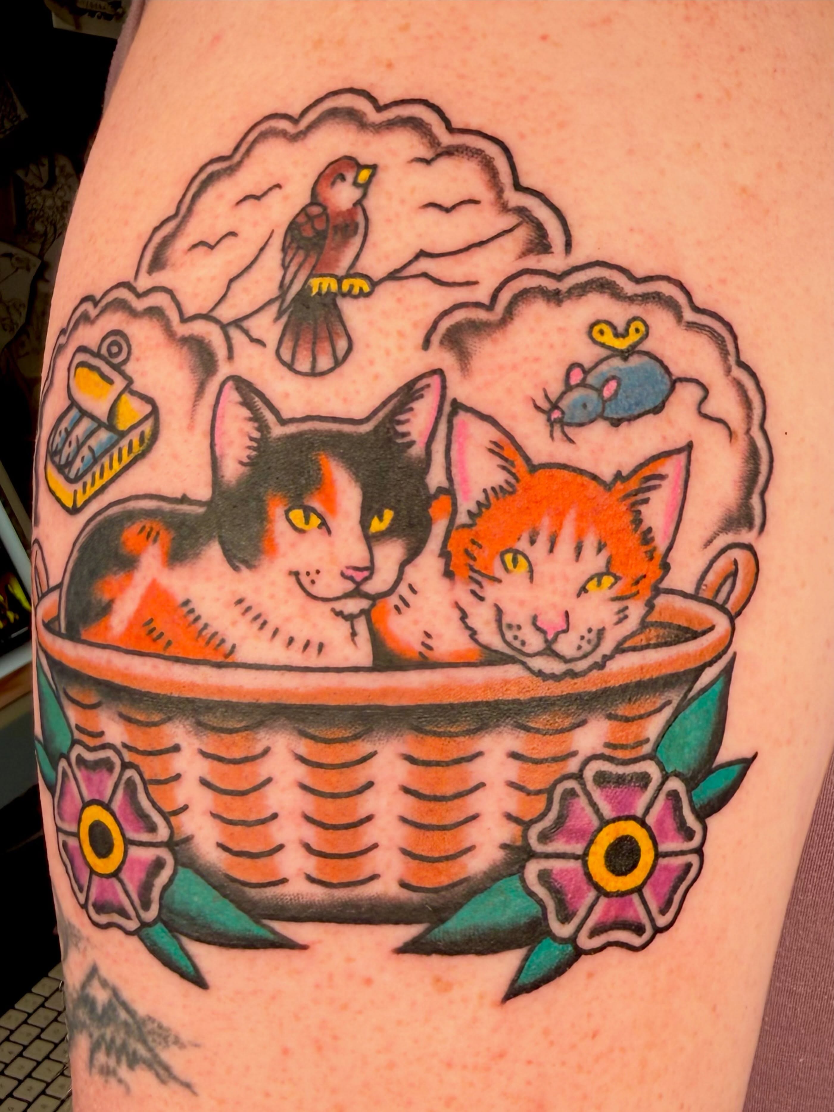 Cats in basket American traditional tattoo on the thigh by Henry Bubula, Minneapolis, Minnesota