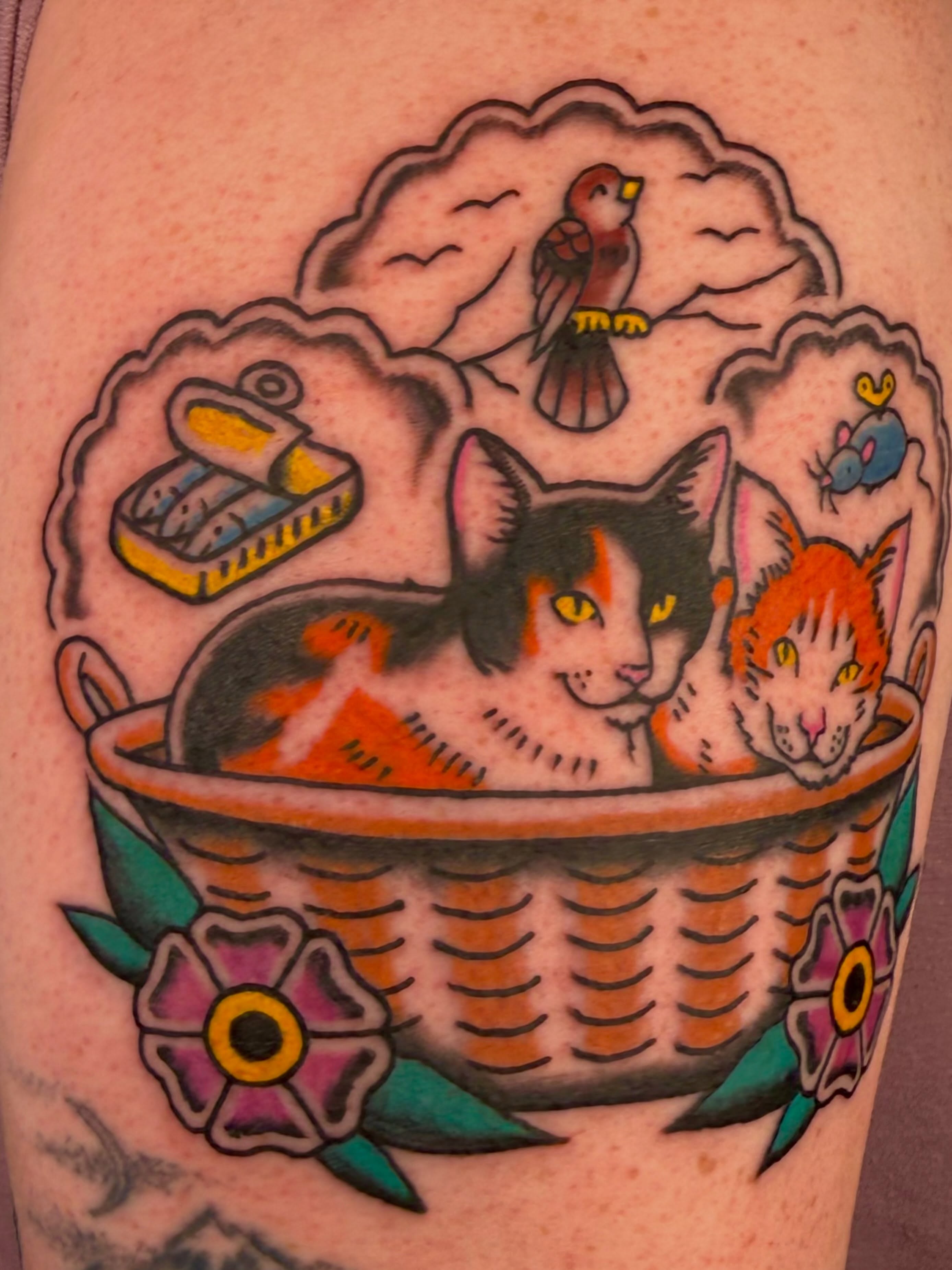 Cats in basket American traditional tattoo on the thigh by Henry Bubula, Minneapolis, Minnesota