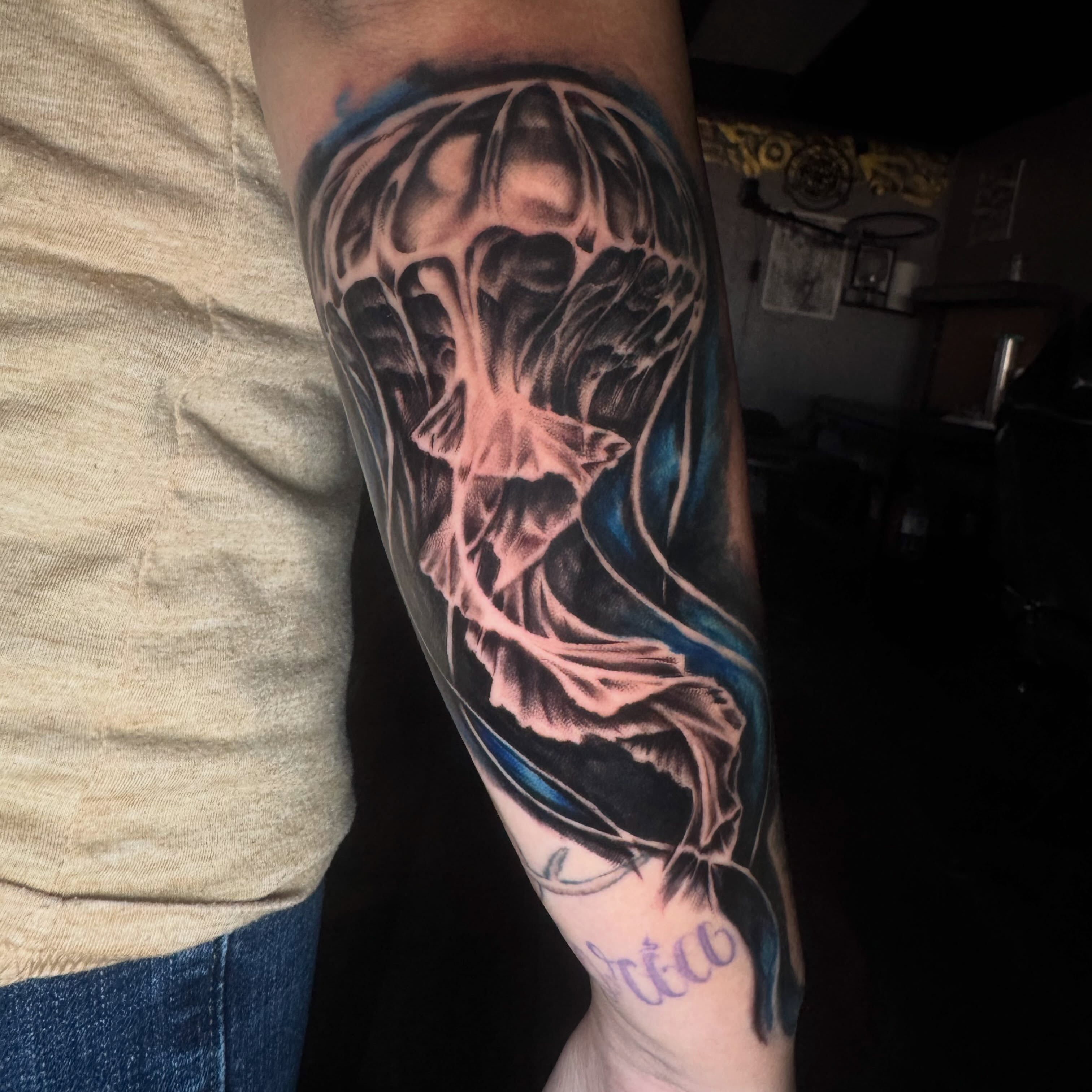 Jellyfish realism tattoo on the forearm by Steve