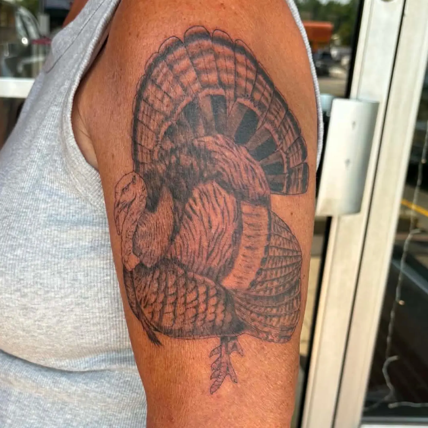 Turkey black and grey tattoo on the upper arm by Hannah Hayes, Livonia, Michigan