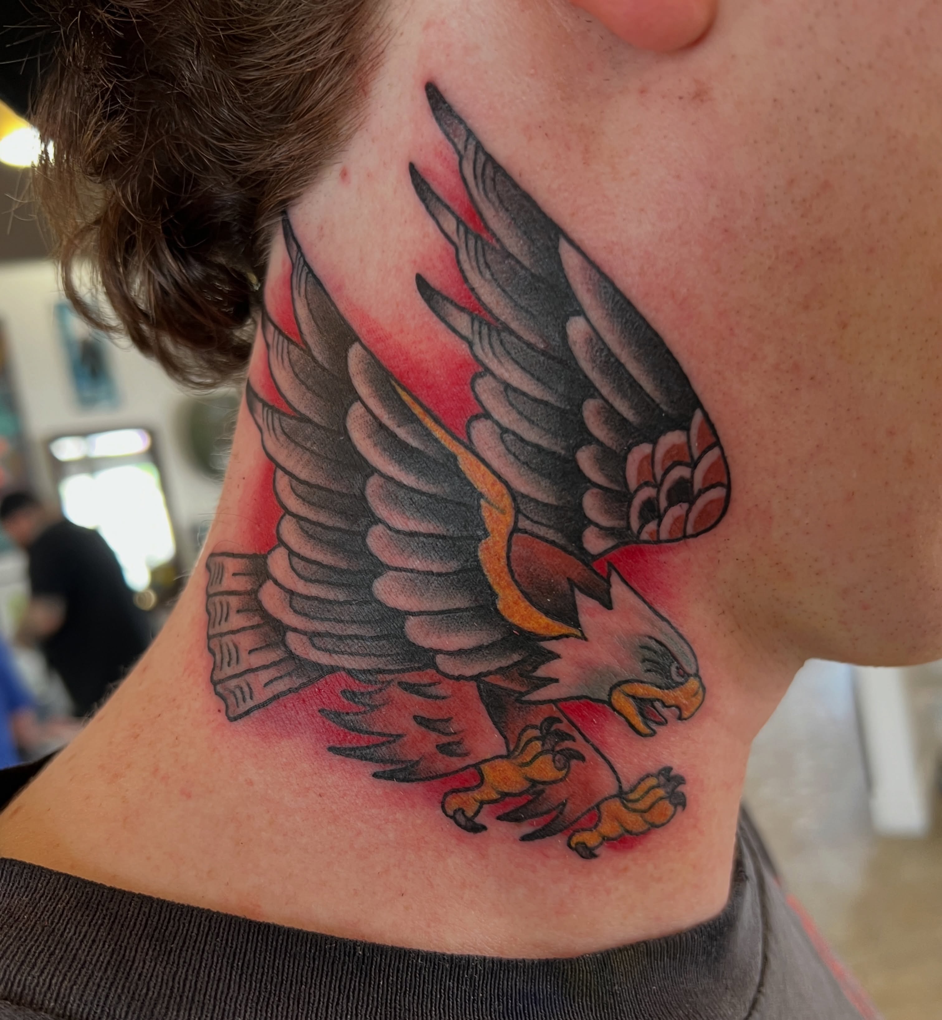 Eagle American traditional tattoo on the neck by Cary Aldridge