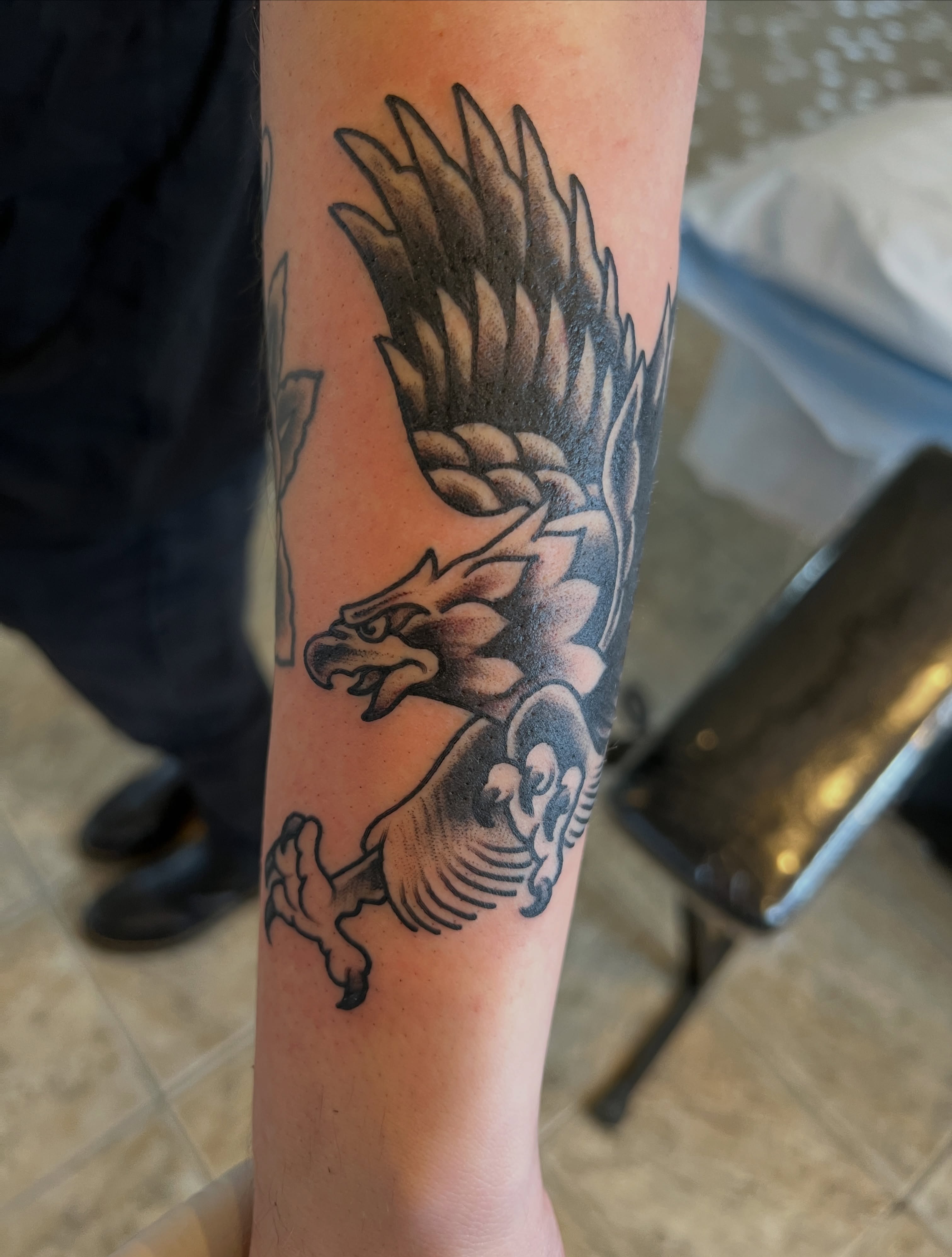 Eagle black and grey tattoo on the forearm by Cary Aldridge
