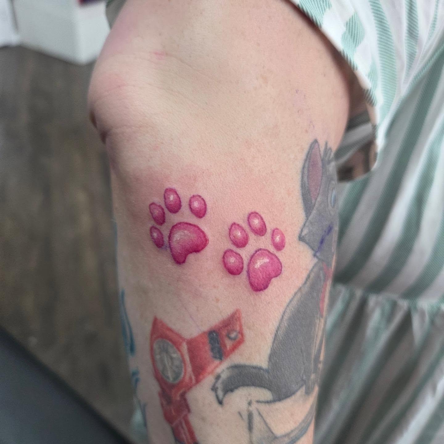 Cat paw prints dotwork tattoo on the forearm by Matthew Todd Kremer