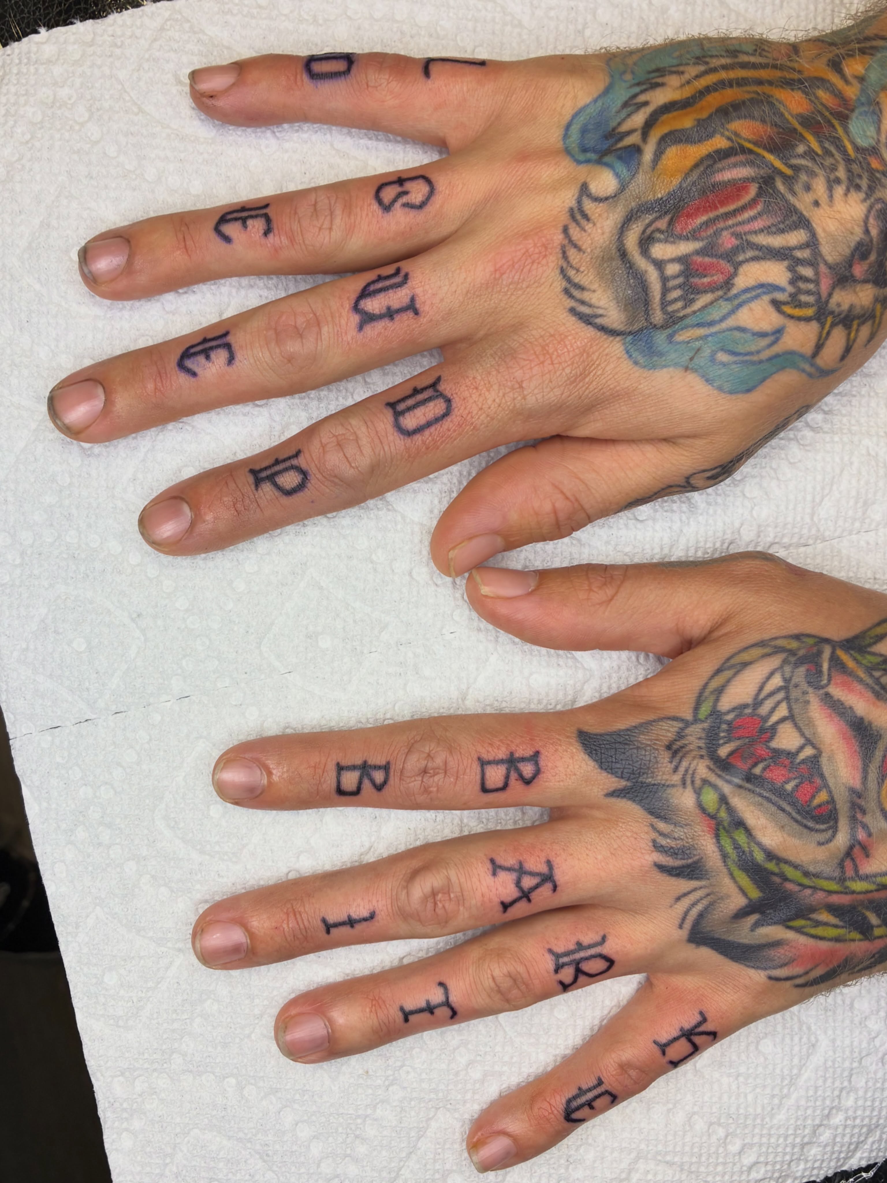 Tattooed letters American traditional tattoo on the hand by Lance 🦈