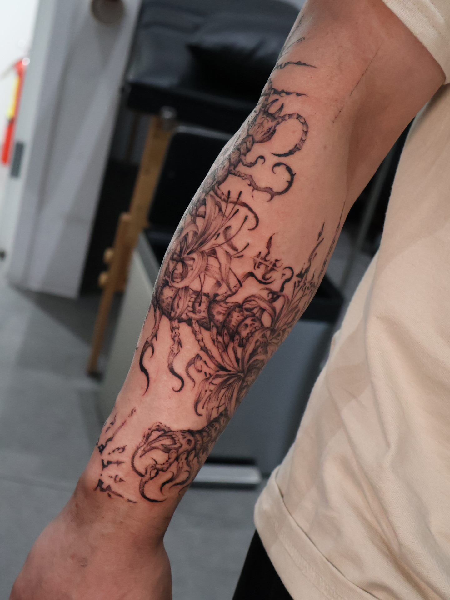 Mythical creature black and grey tattoo on the forearm by Grace Zarmina Hessam