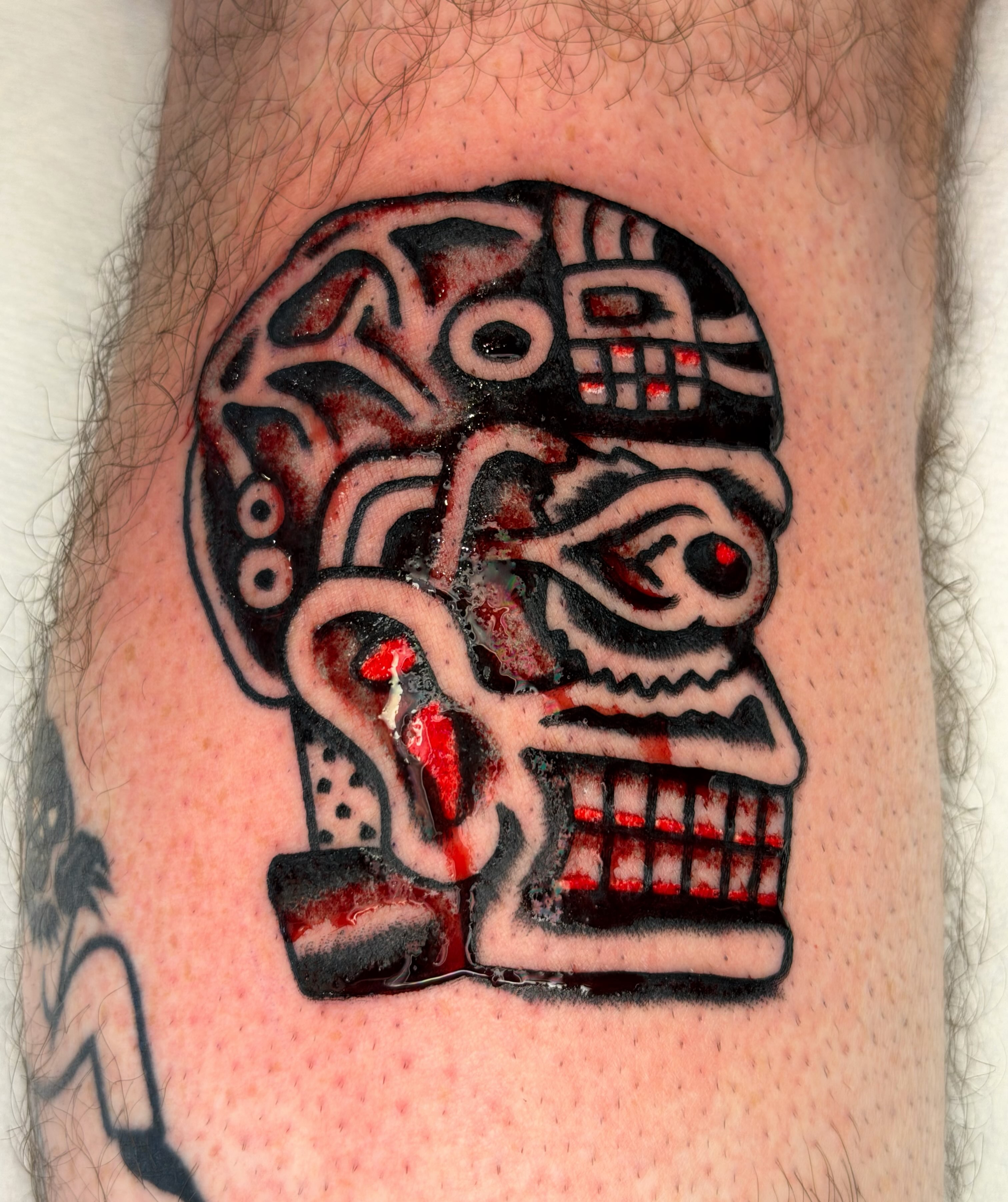Skull black and grey tattoo on the forearm by Jake