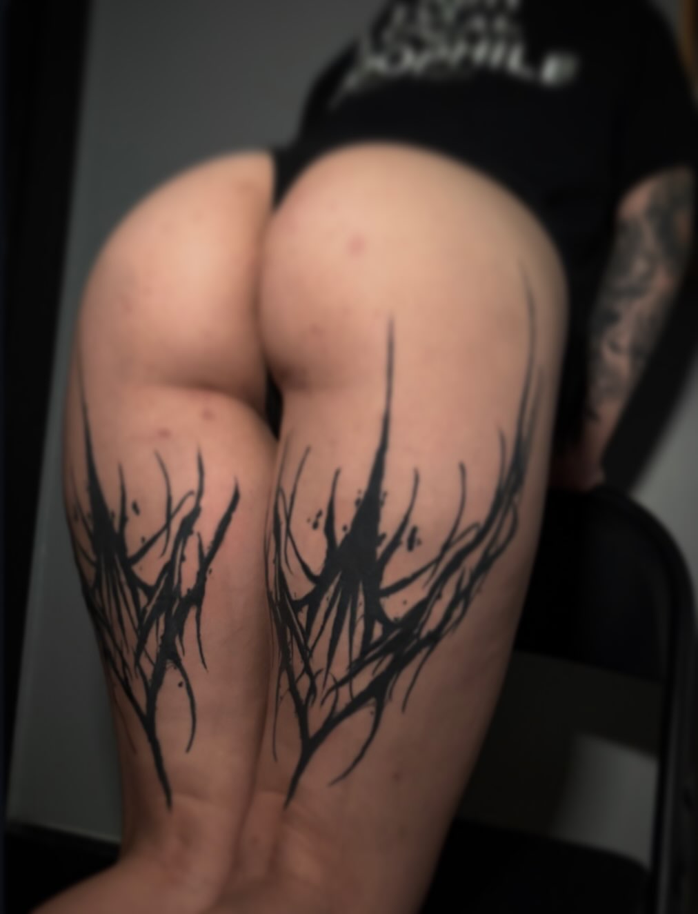 Abstract plant black and grey tattoo on the forearm by Cameron Scofield
