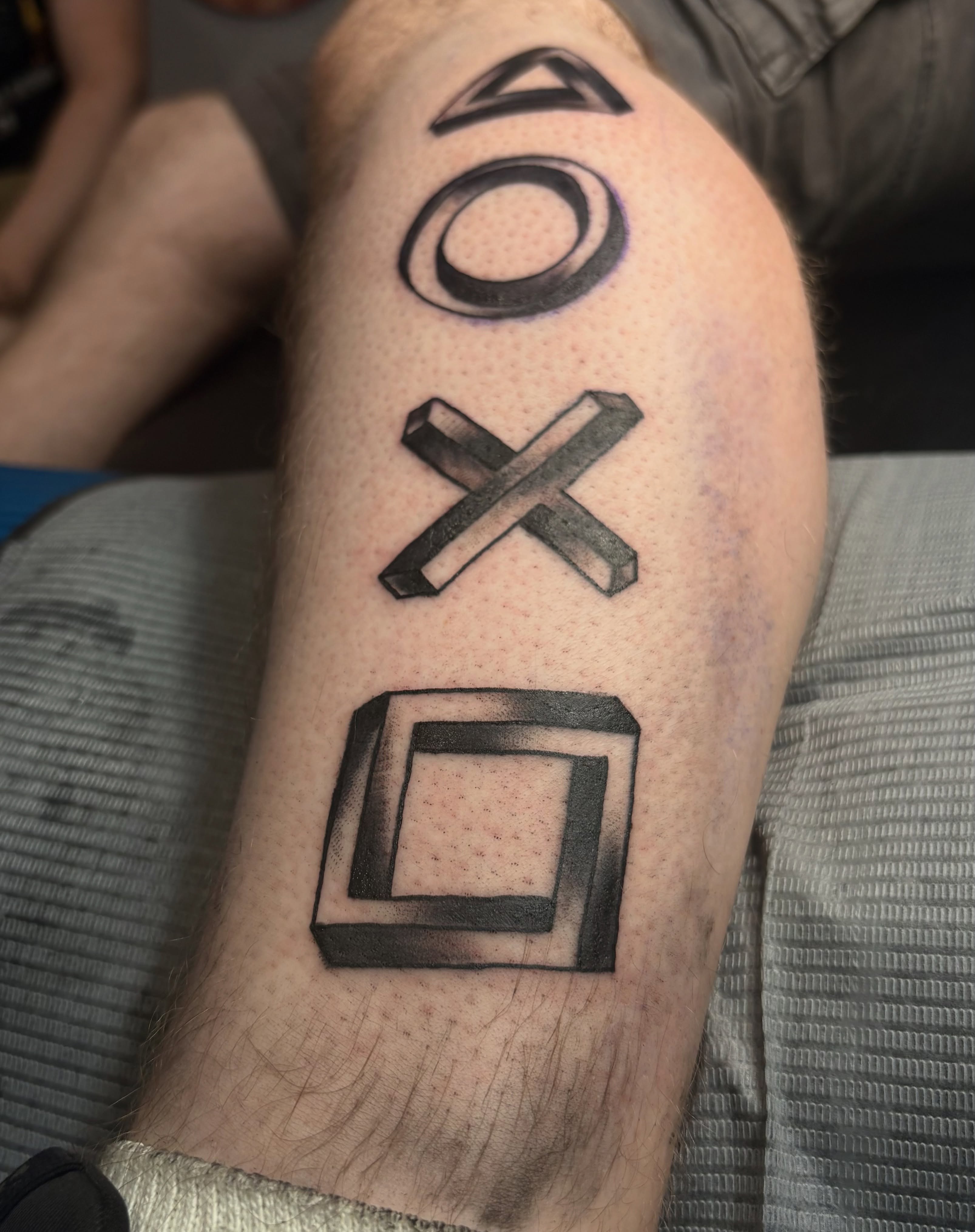 PS4 controller symbols geometric tattoo on the forearm by Casey - Tattooer, Salem, Massachusetts