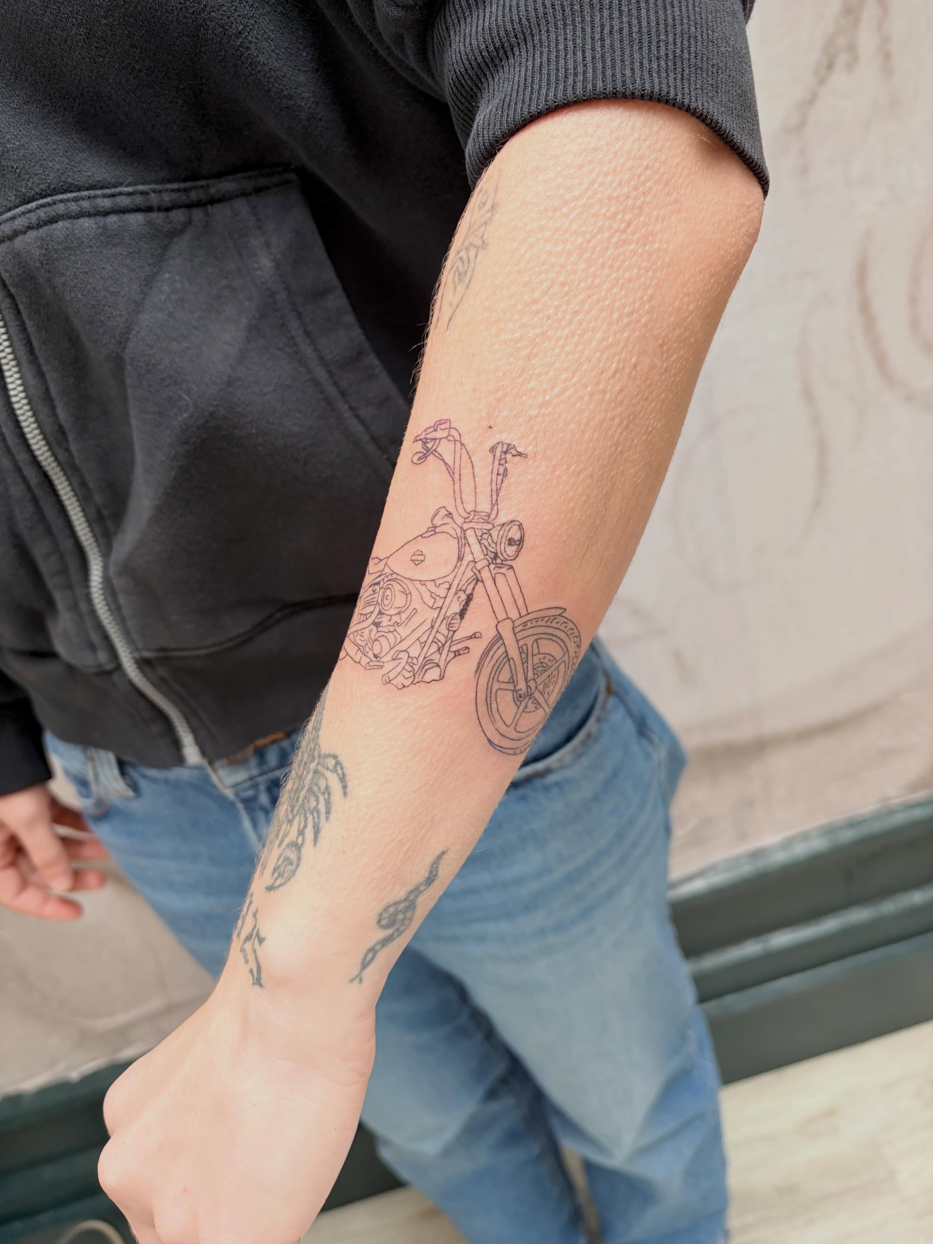 Motorcycle black and grey tattoo on the forearm by Sam Padilla