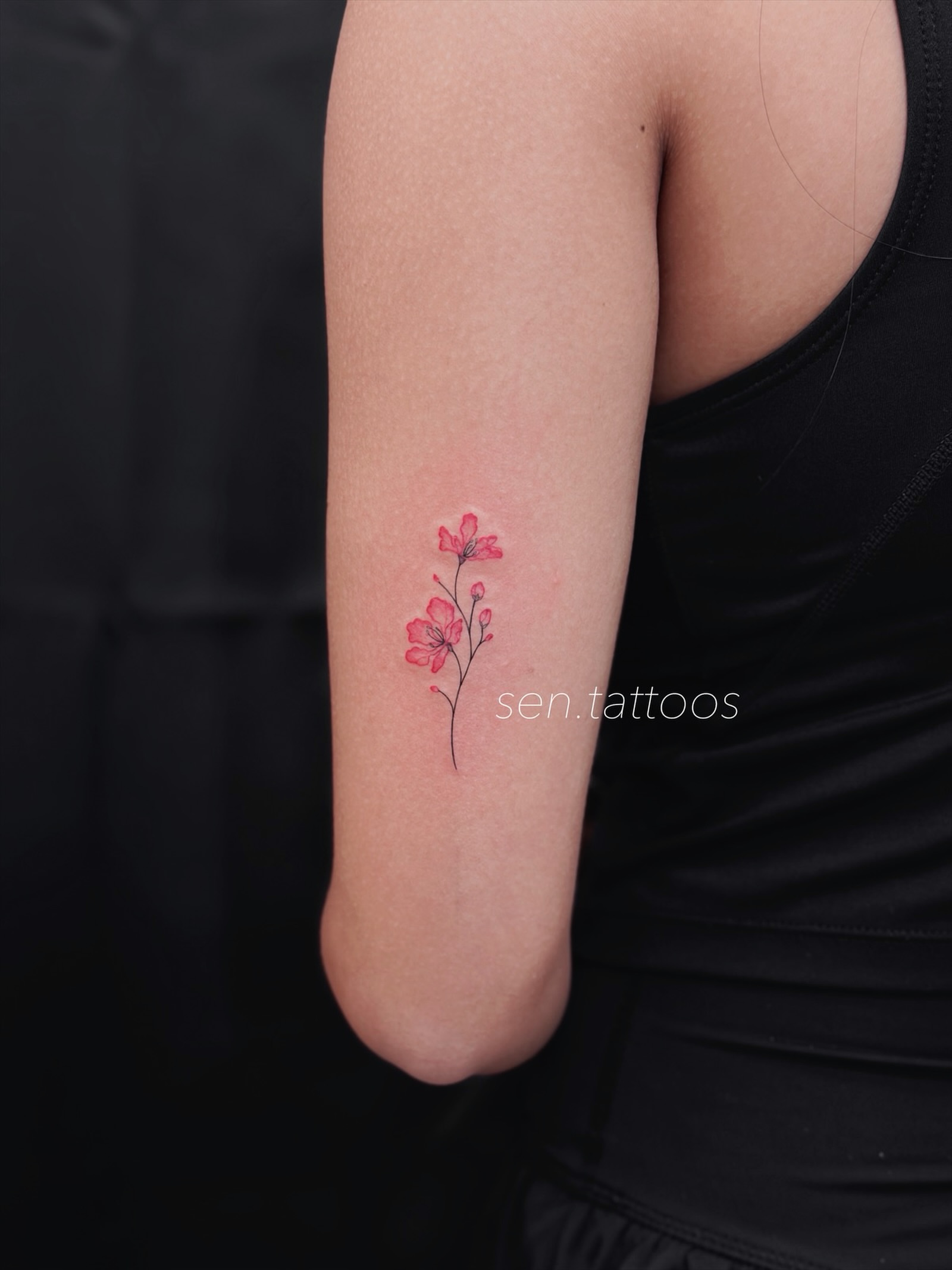 Cherry blossoms watercolor tattoo on the forearm by Sen Tattooer