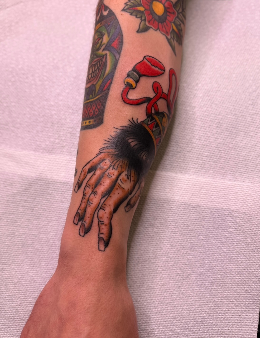 Hands American traditional tattoo on the forearm by Ethan, Toledo, Ohio