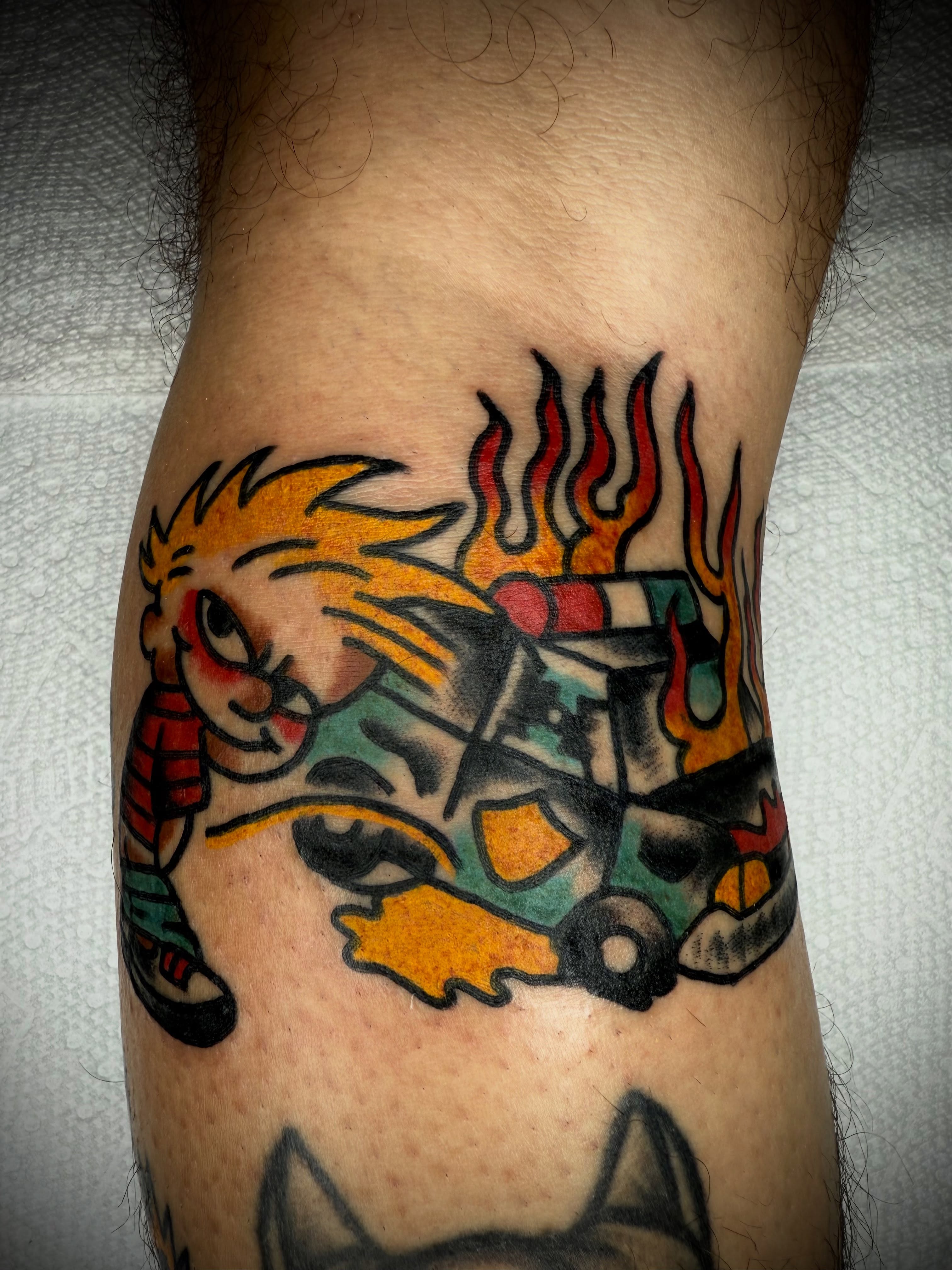 Calvin and hobbes American traditional tattoo on the forearm by Victoria Lagano NYC Traditional Tattoos