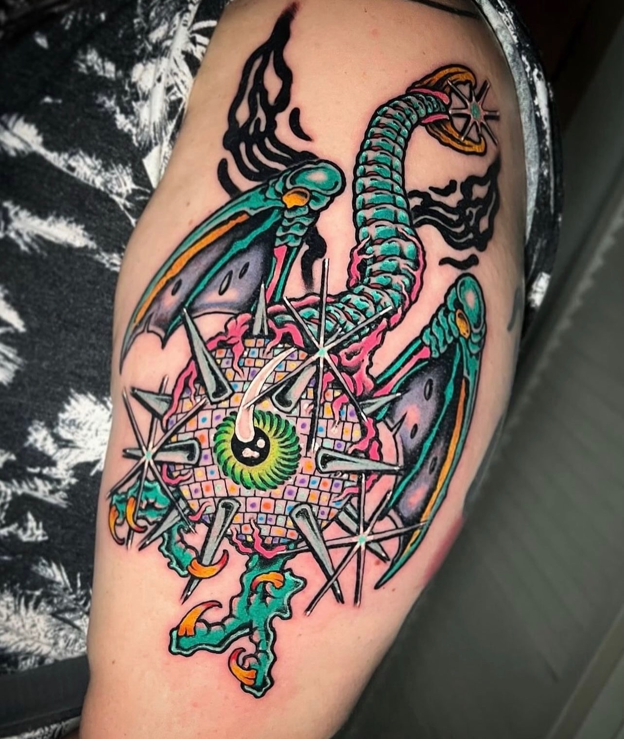 Astronaut and snake new school tattoo on the thigh by Jade Napier