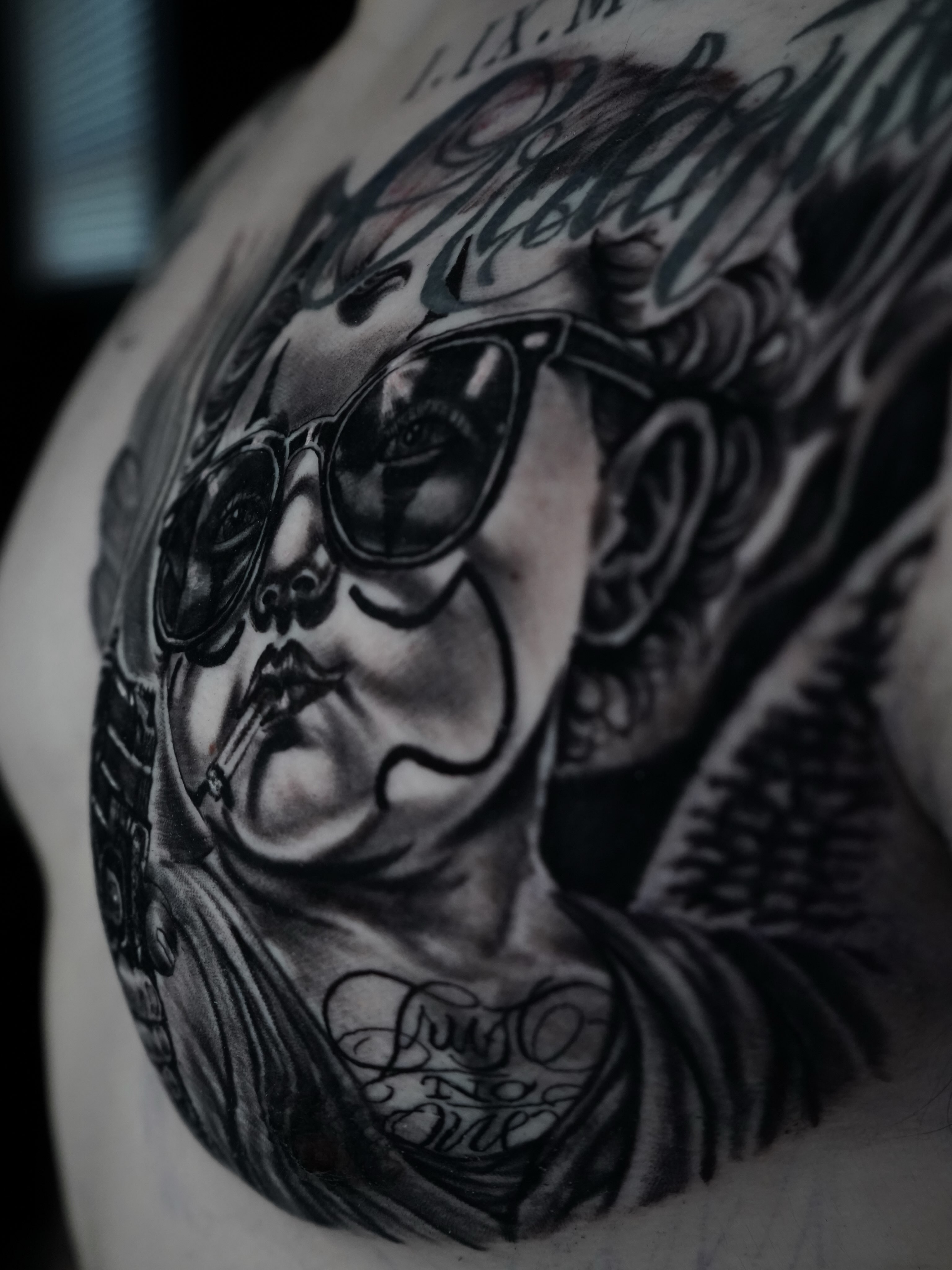 Portrait black and grey tattoo on the chest by Carlos Trujillo