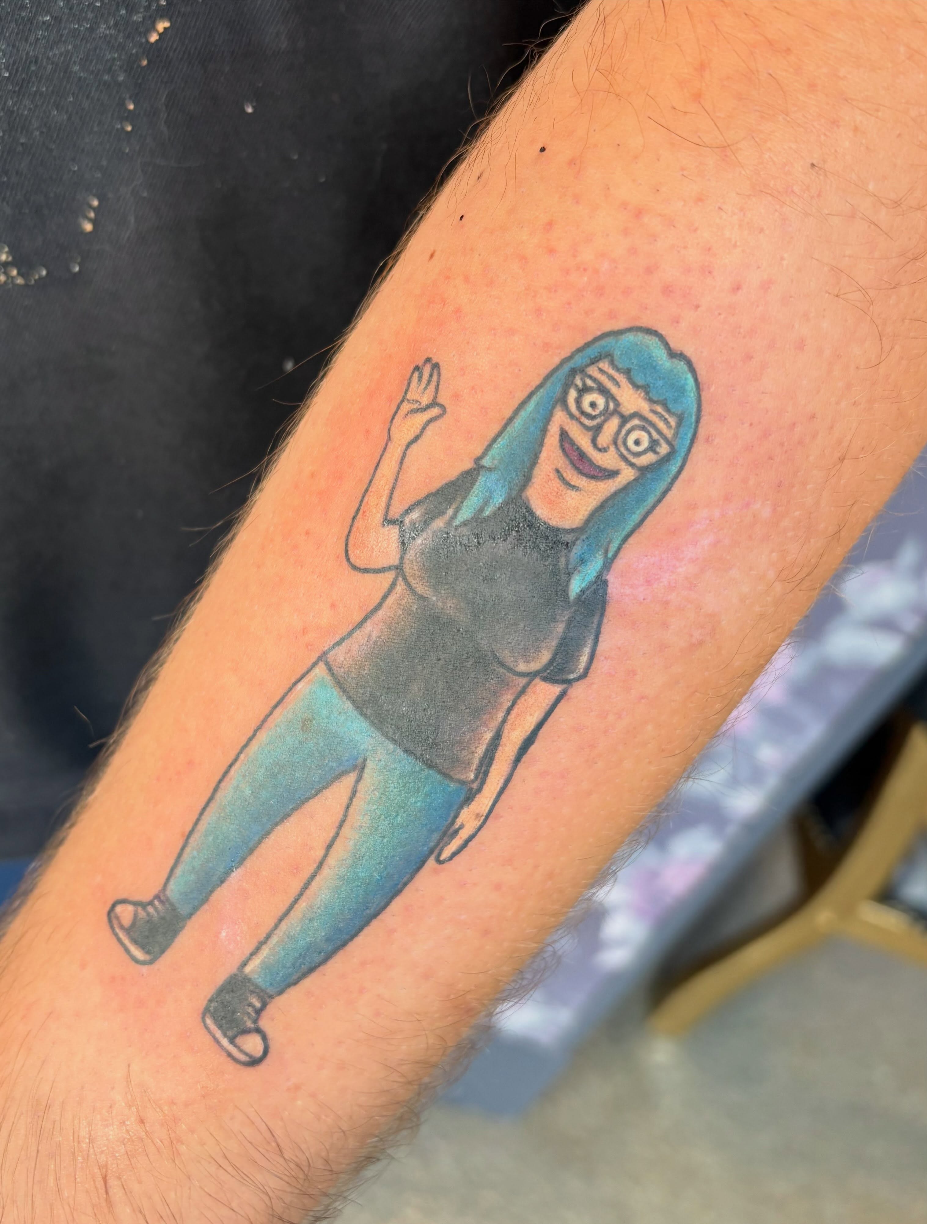 Character illustrative tattoo on the forearm by Bre Alex