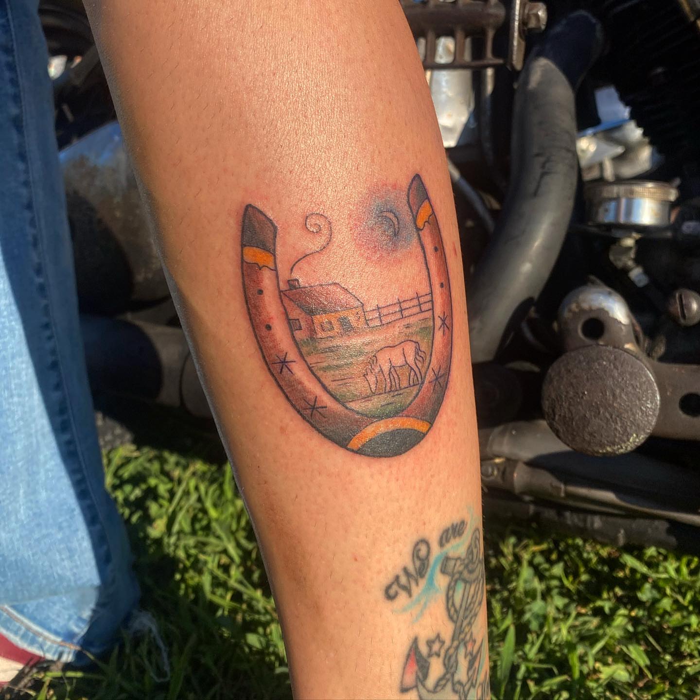 Horseshoe with farm scene American traditional tattoo on the forearm by adrienne mae ❀