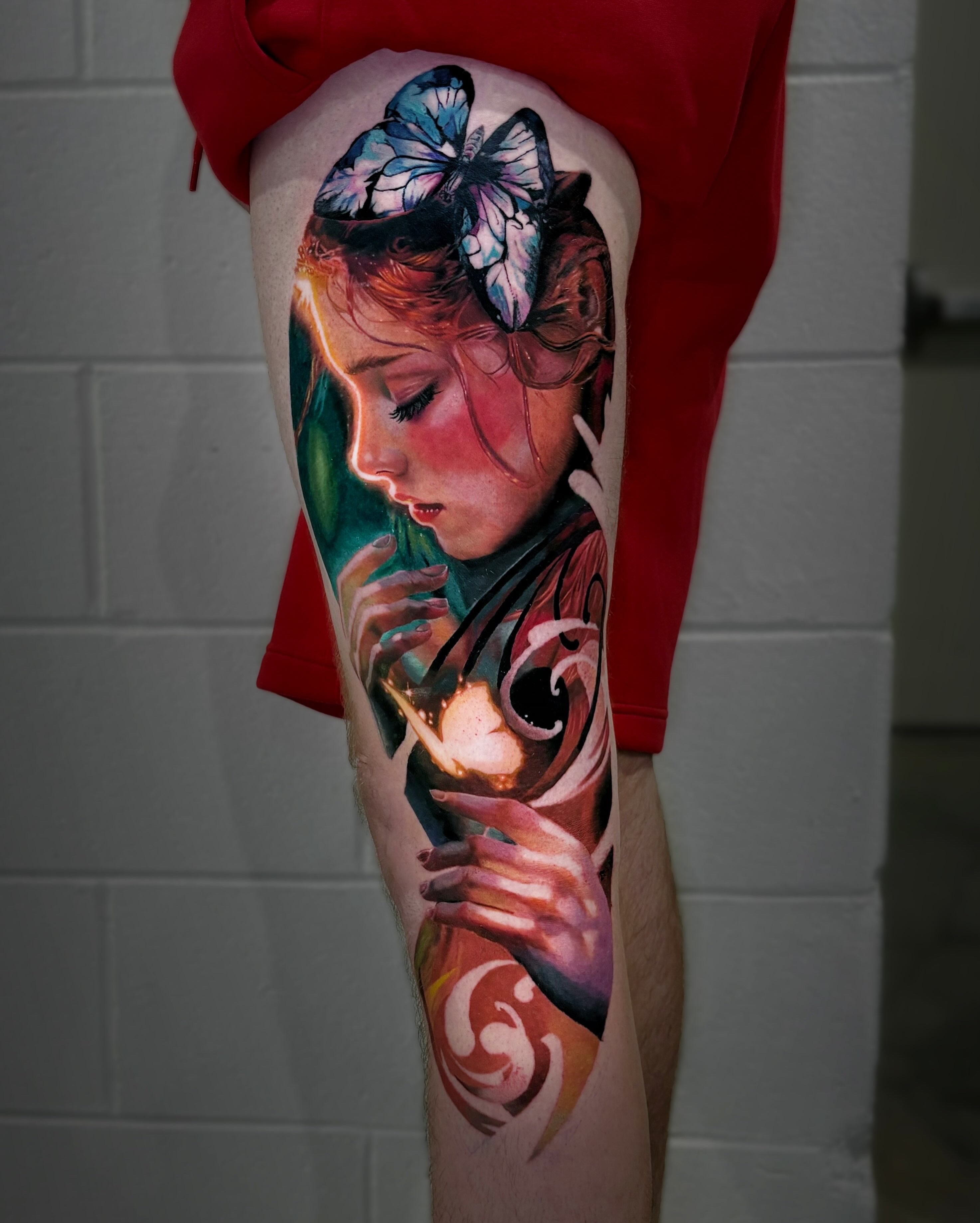 Woman with butterfly realism tattoo on the thigh by Yu Chen