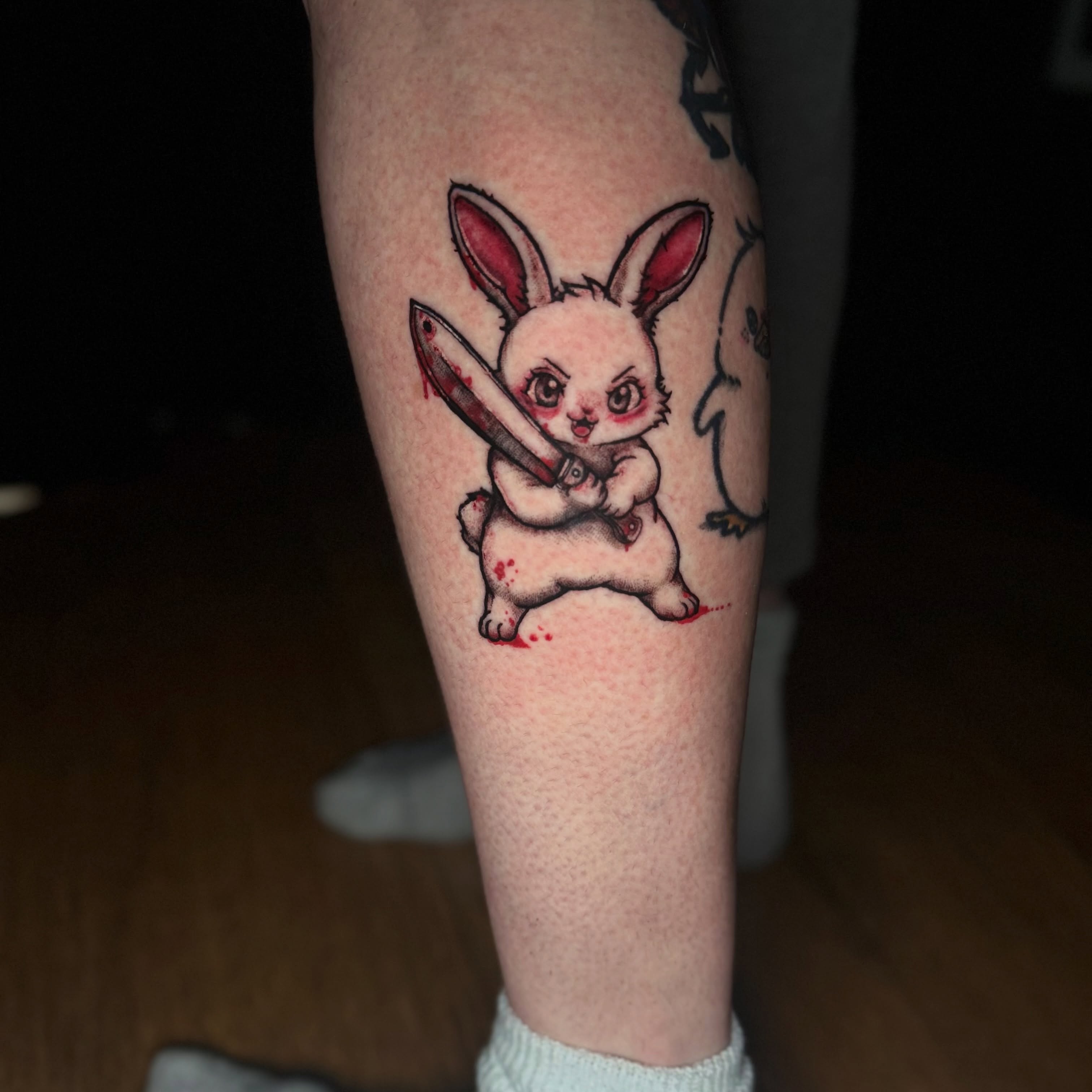 Chibi rabbit holding knife dotwork tattoo on the forearm by Chuckthegirl