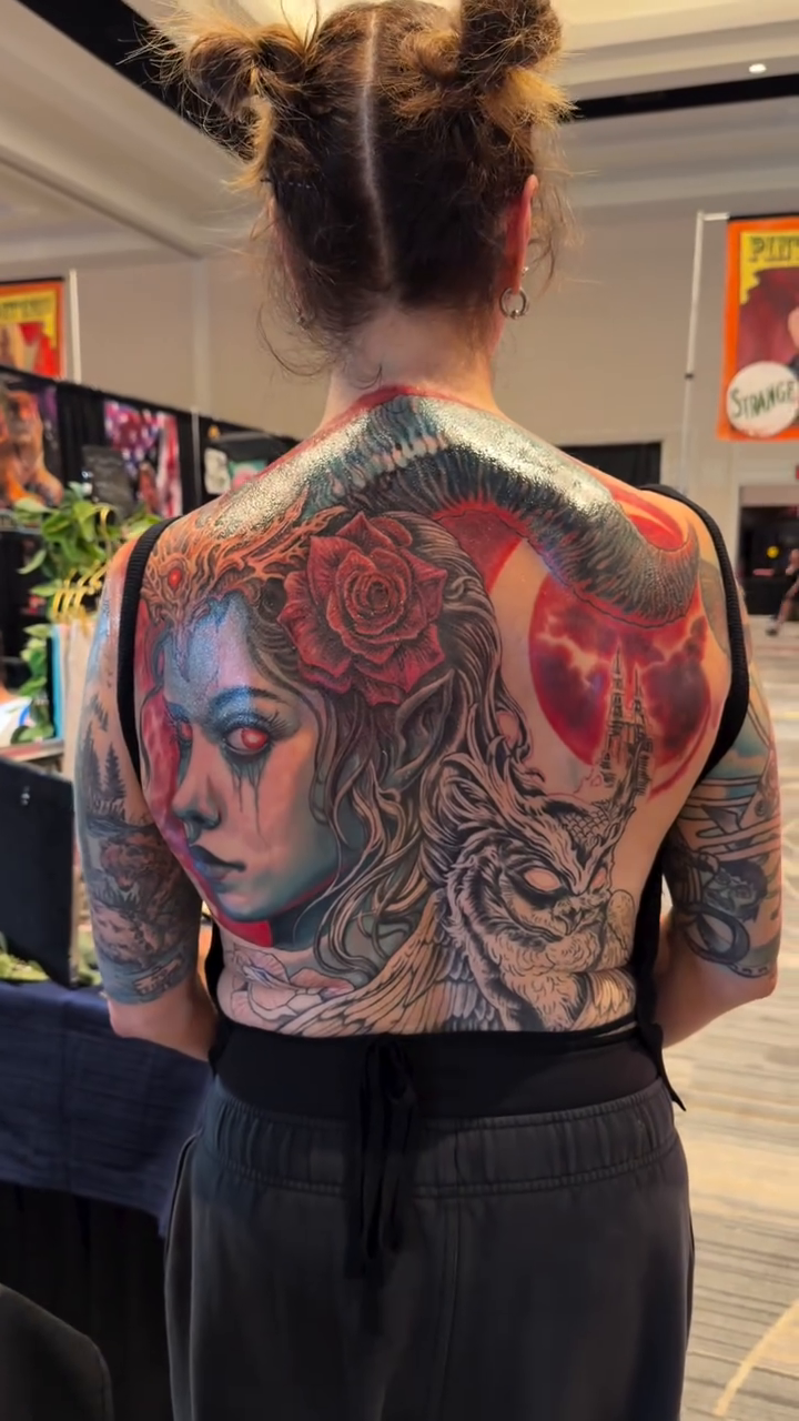 Woman with roses and dragon realism tattoo by Jamie Lee Parker