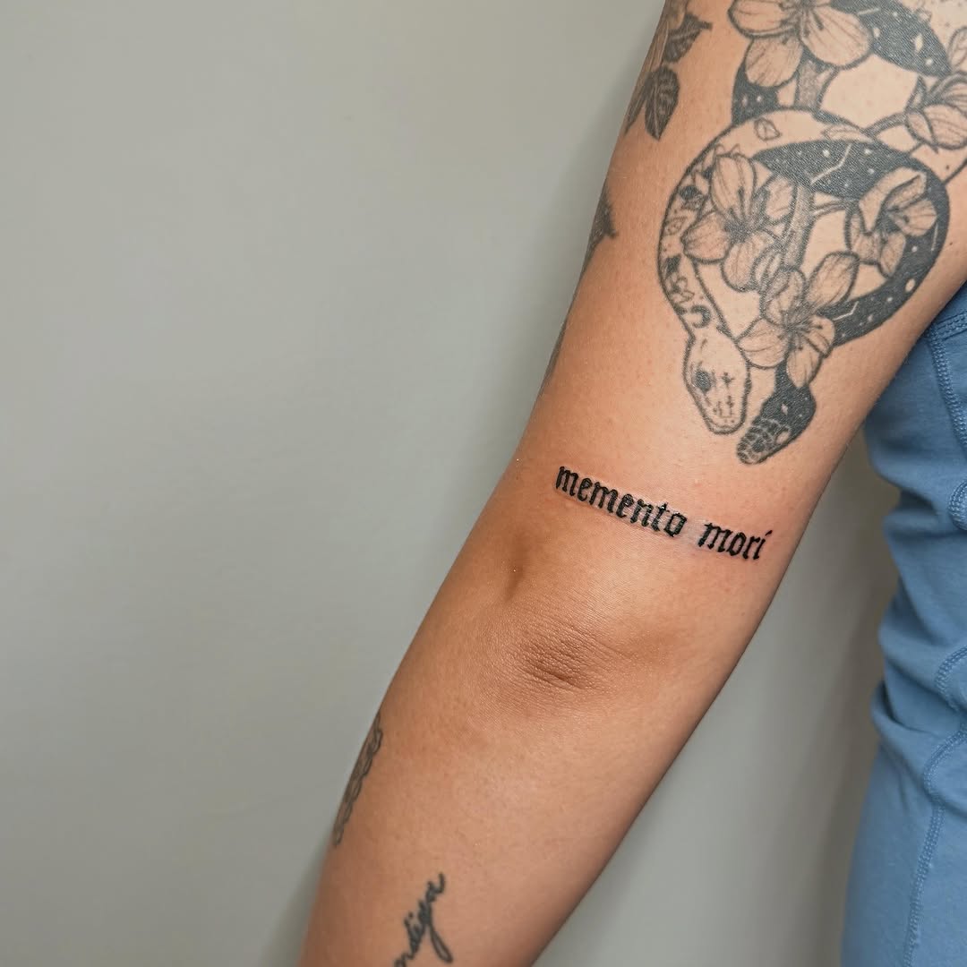 Memento mori black and grey tattoo on the forearm by Ashlee Burkey