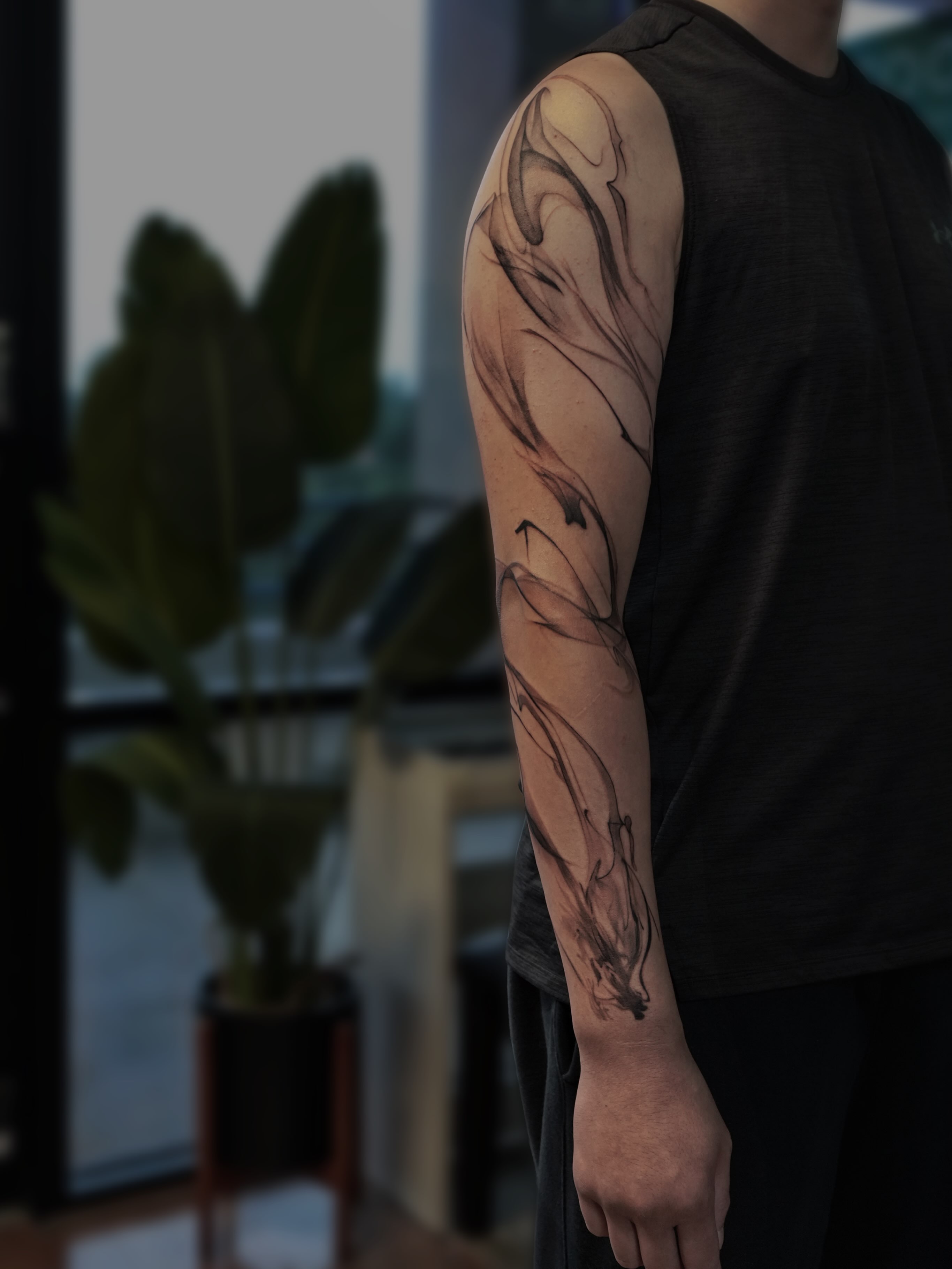 Abstract swirls black and grey tattoo on the forearm by Yu Chen