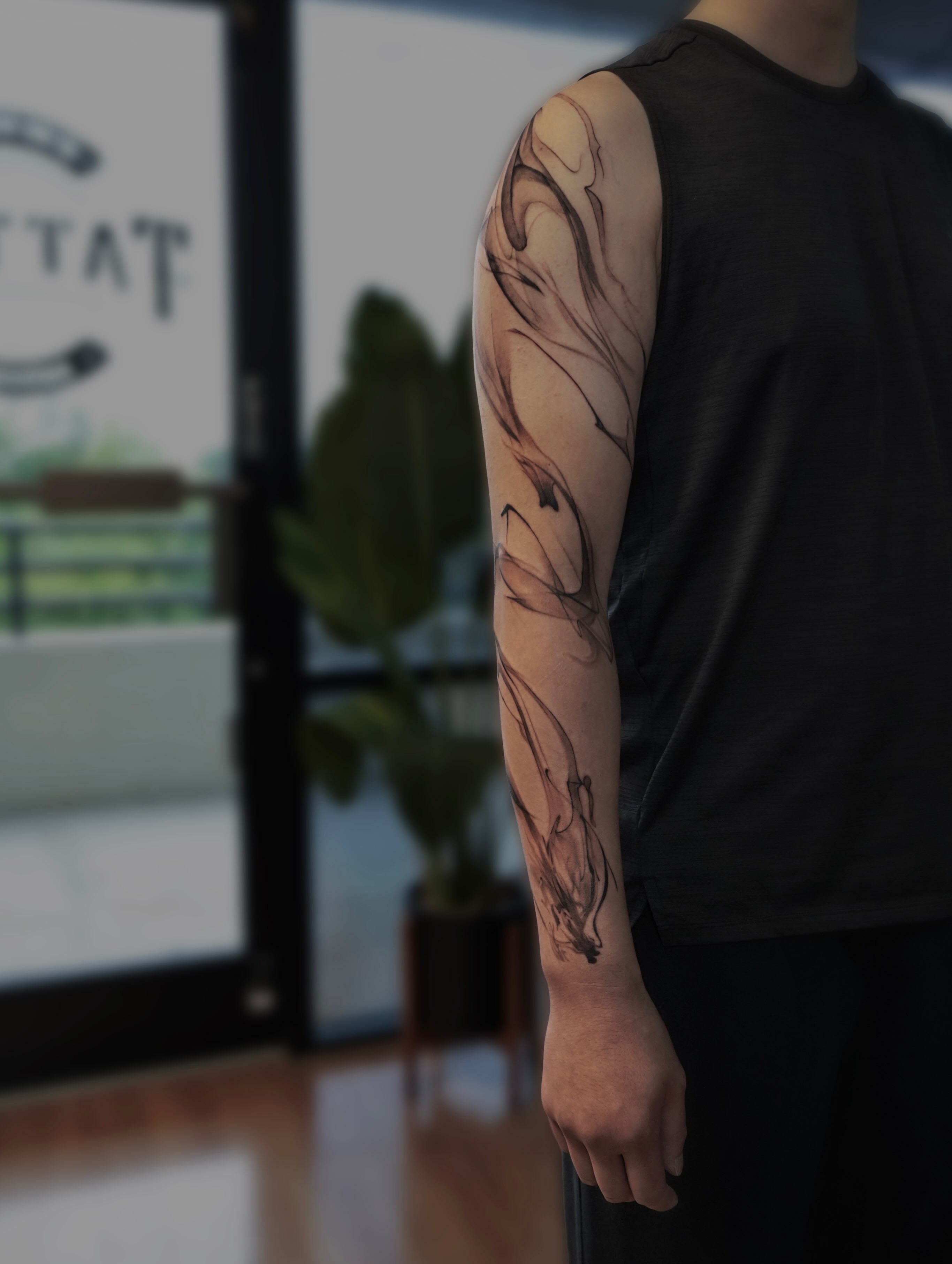 Abstract swirls black and grey tattoo on the forearm by Yu Chen