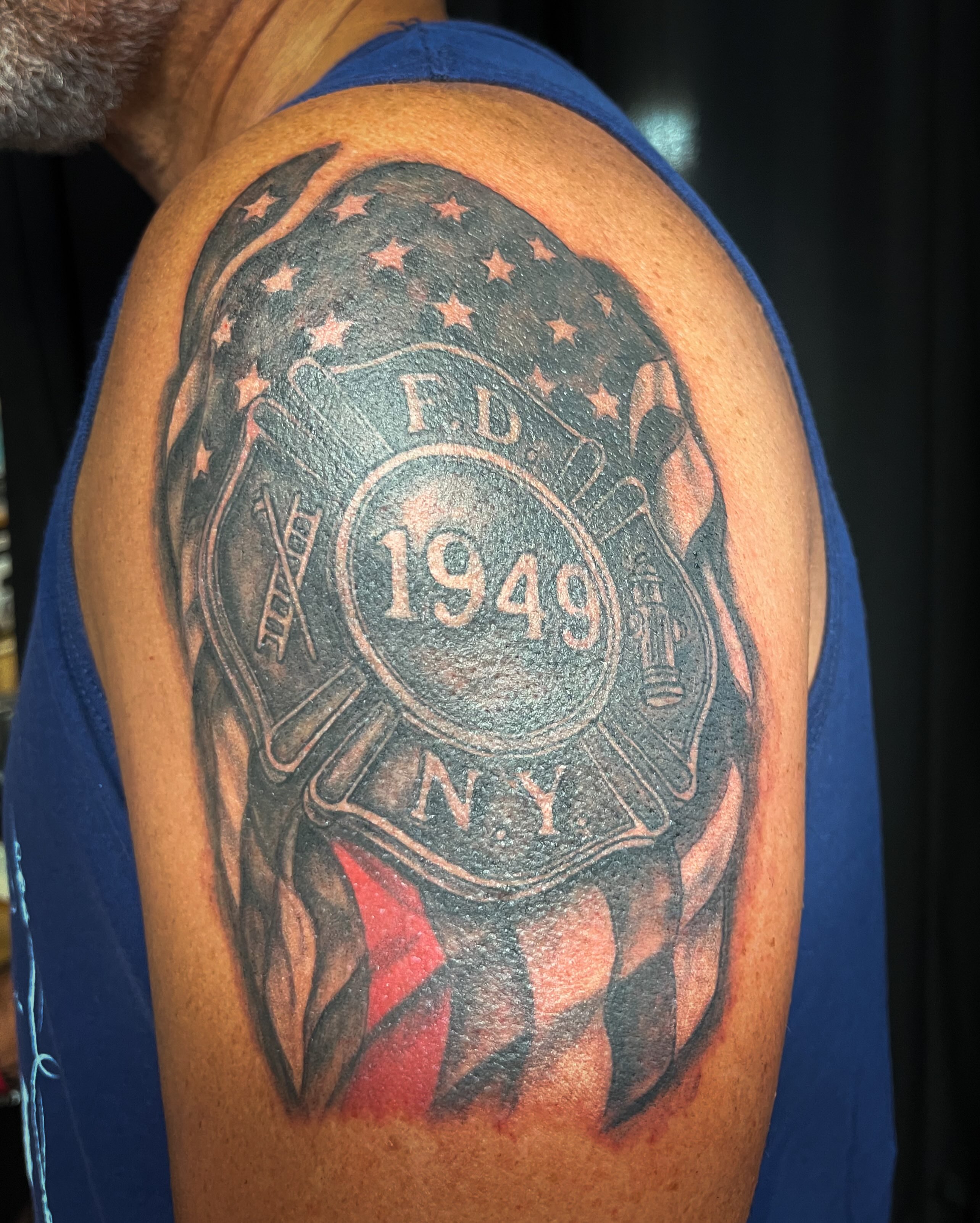 FDNY badge American traditional tattoo on the shoulder by Melissa Peña NYC