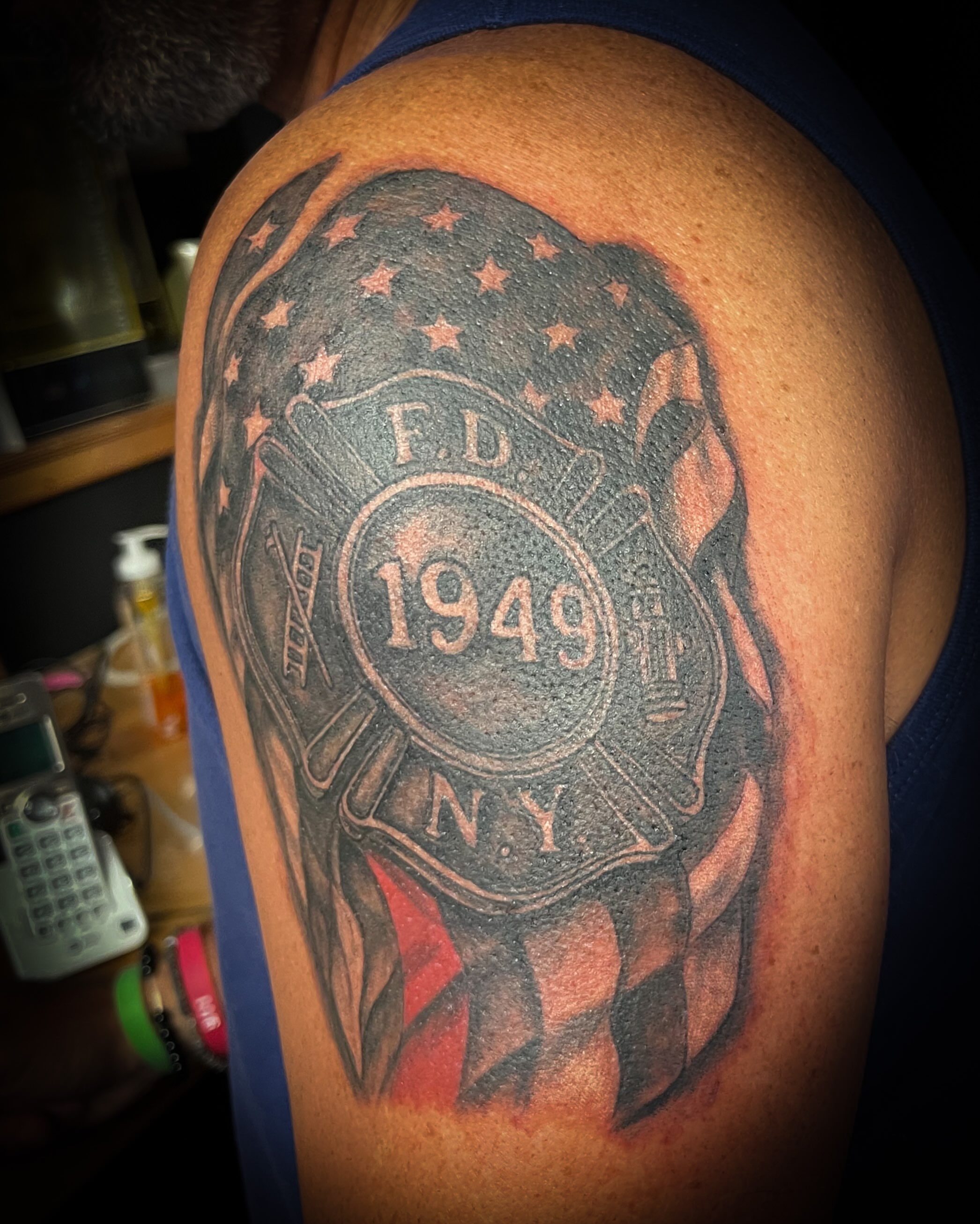 FDNY emblem American traditional tattoo on the shoulder by Melissa Peña NYC