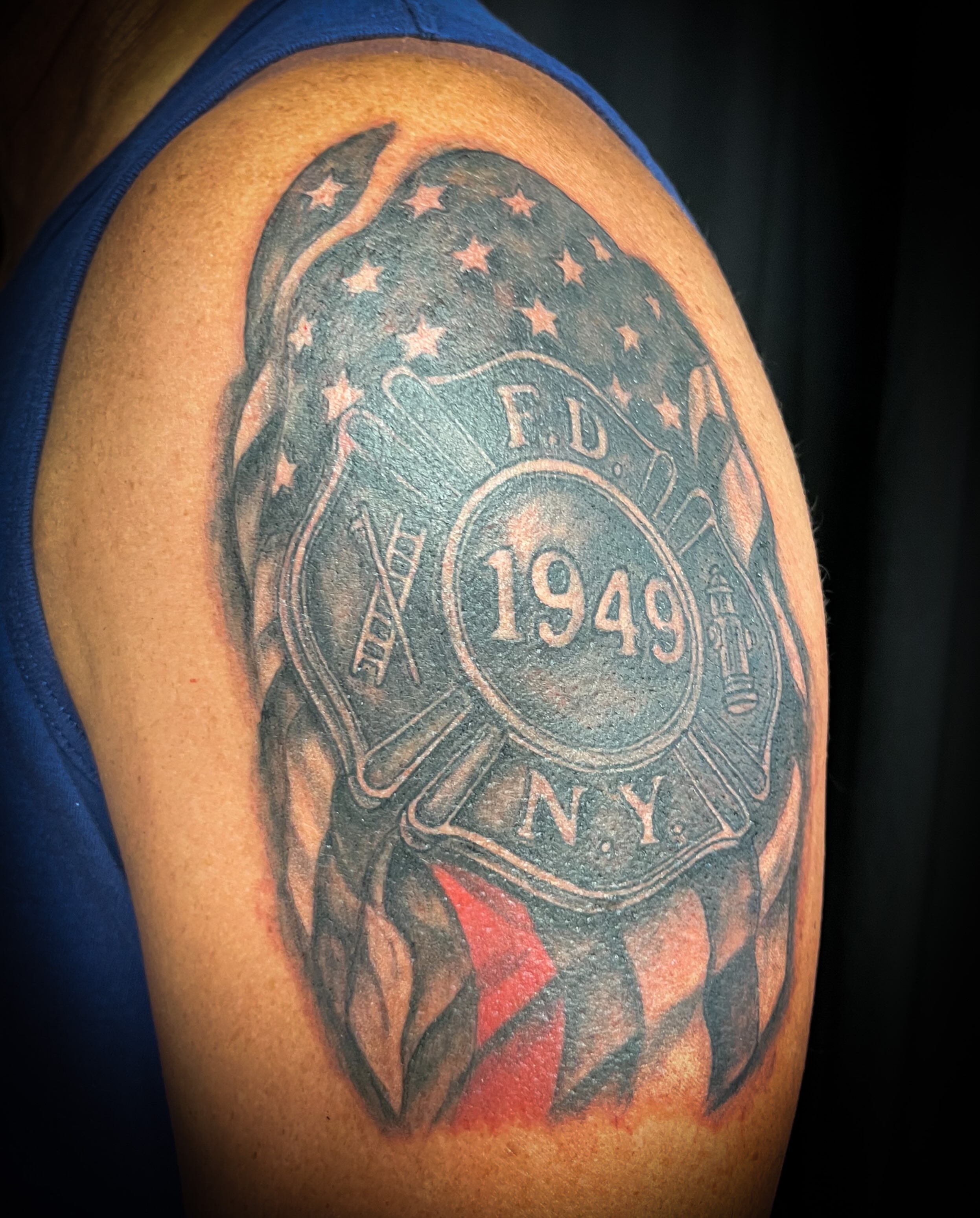 FDNY badge American traditional tattoo on the shoulder by Melissa Peña NYC
