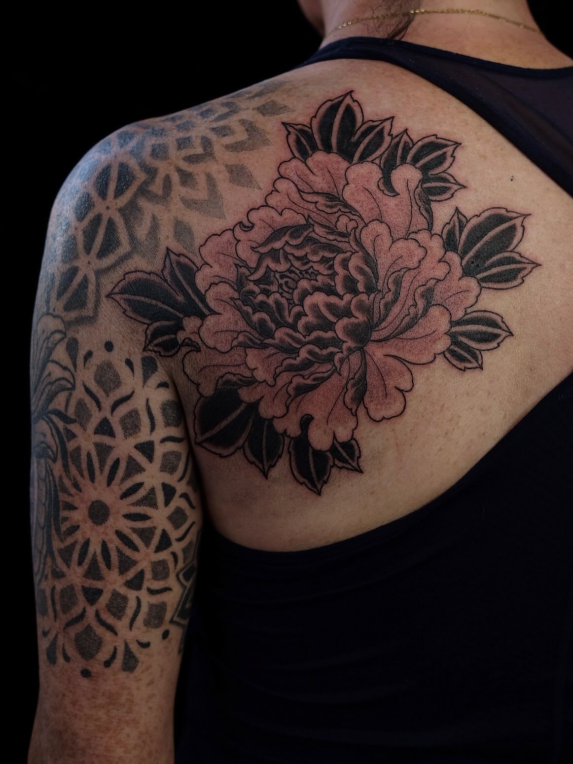 Peony black and grey tattoo on the shoulder by Owlyn Madrone