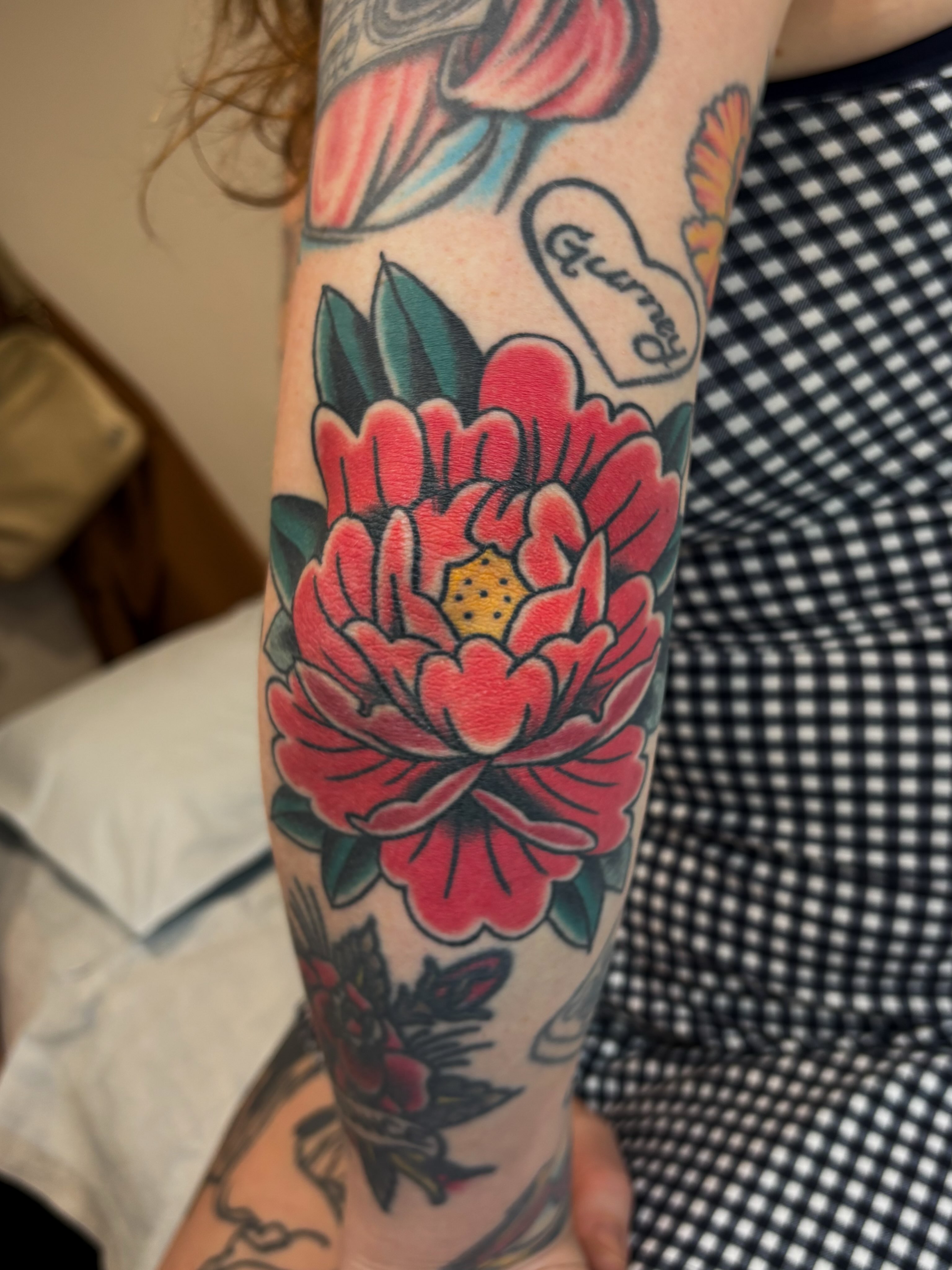 Peony flower American traditional tattoo on the forearm by Evan Bisso, Philadelphia, Pennsylvania