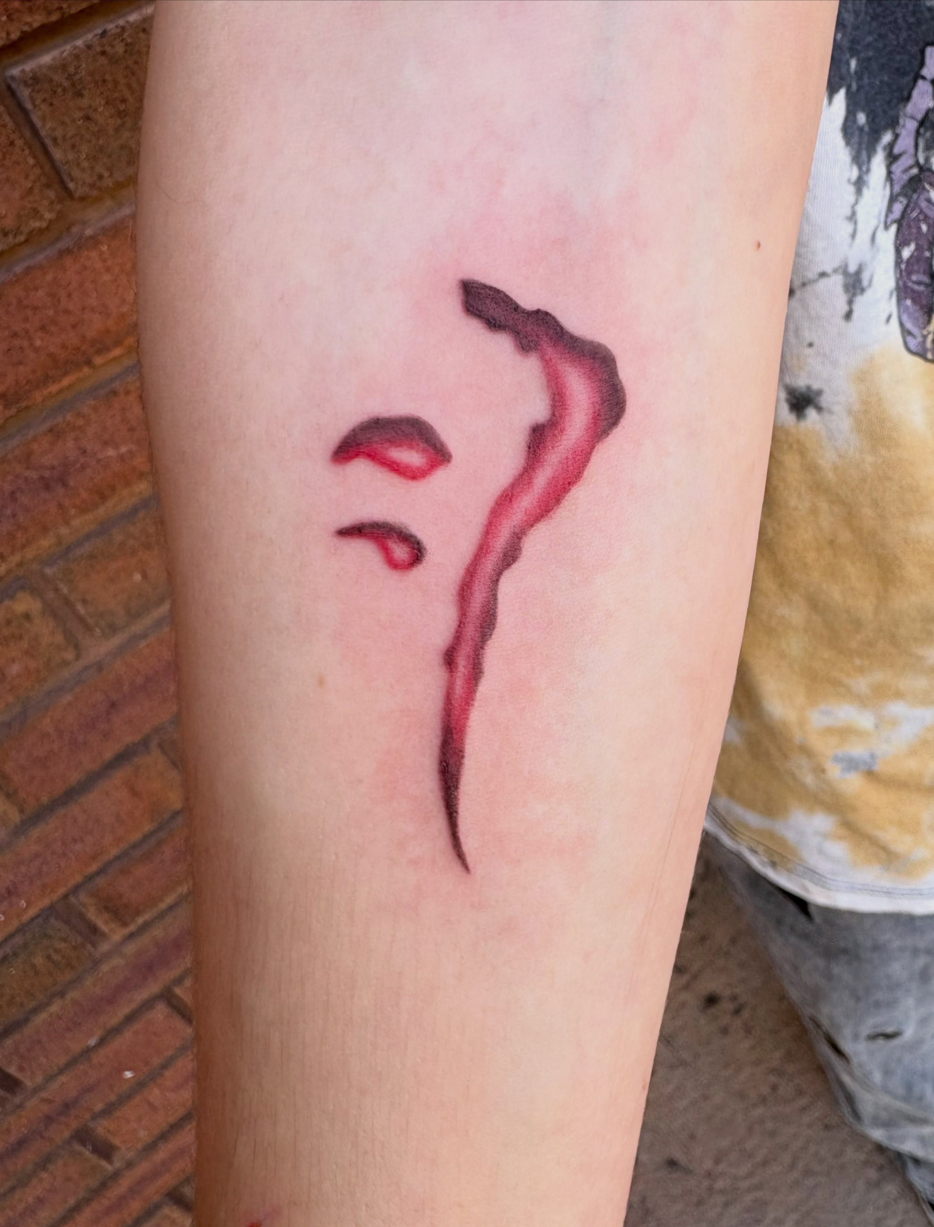 Smoke watercolor tattoo on the forearm by Sierra Maynard