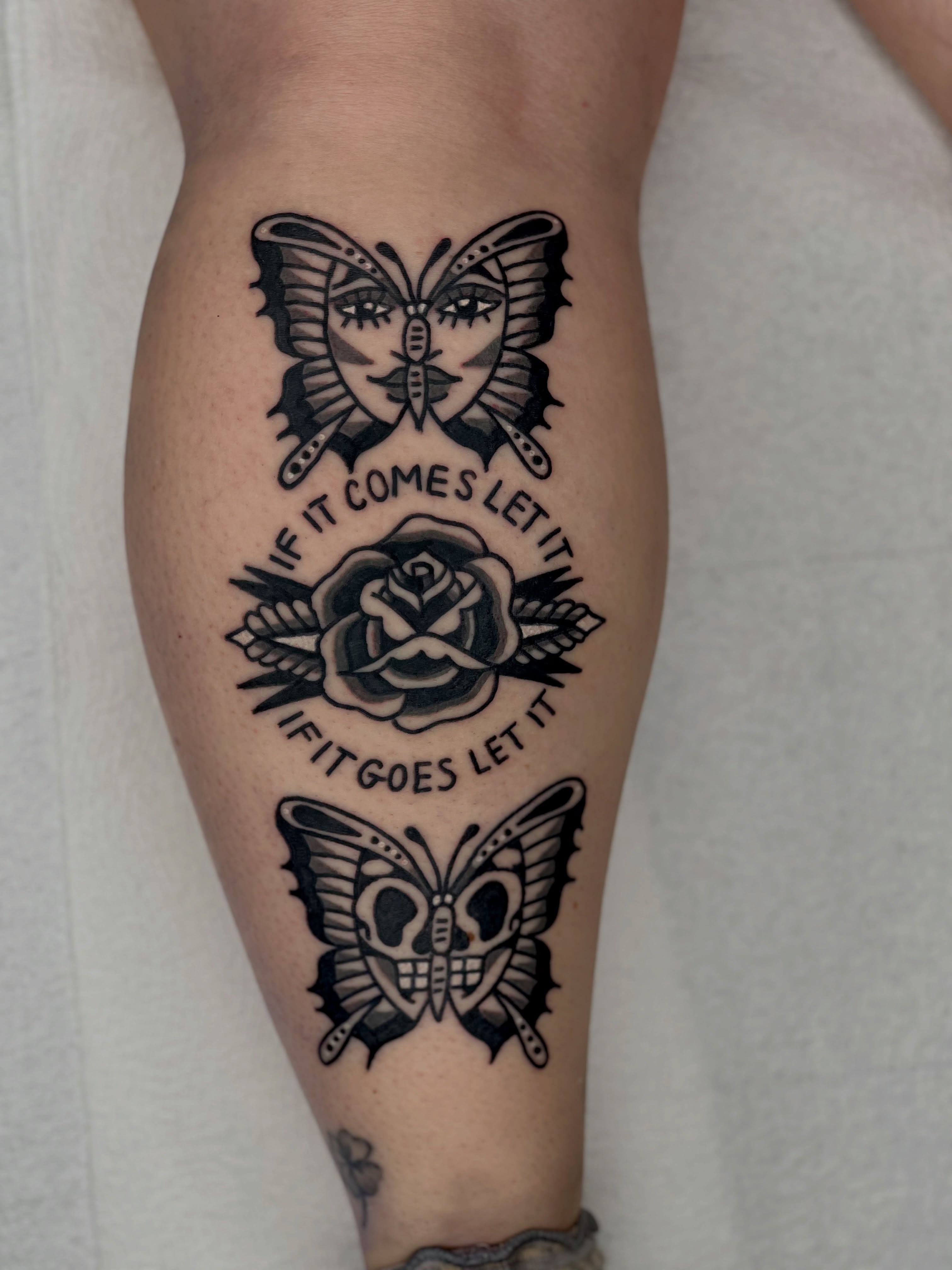 Butterfly, rose, skull American traditional tattoo on the forearm by Christopher Durao