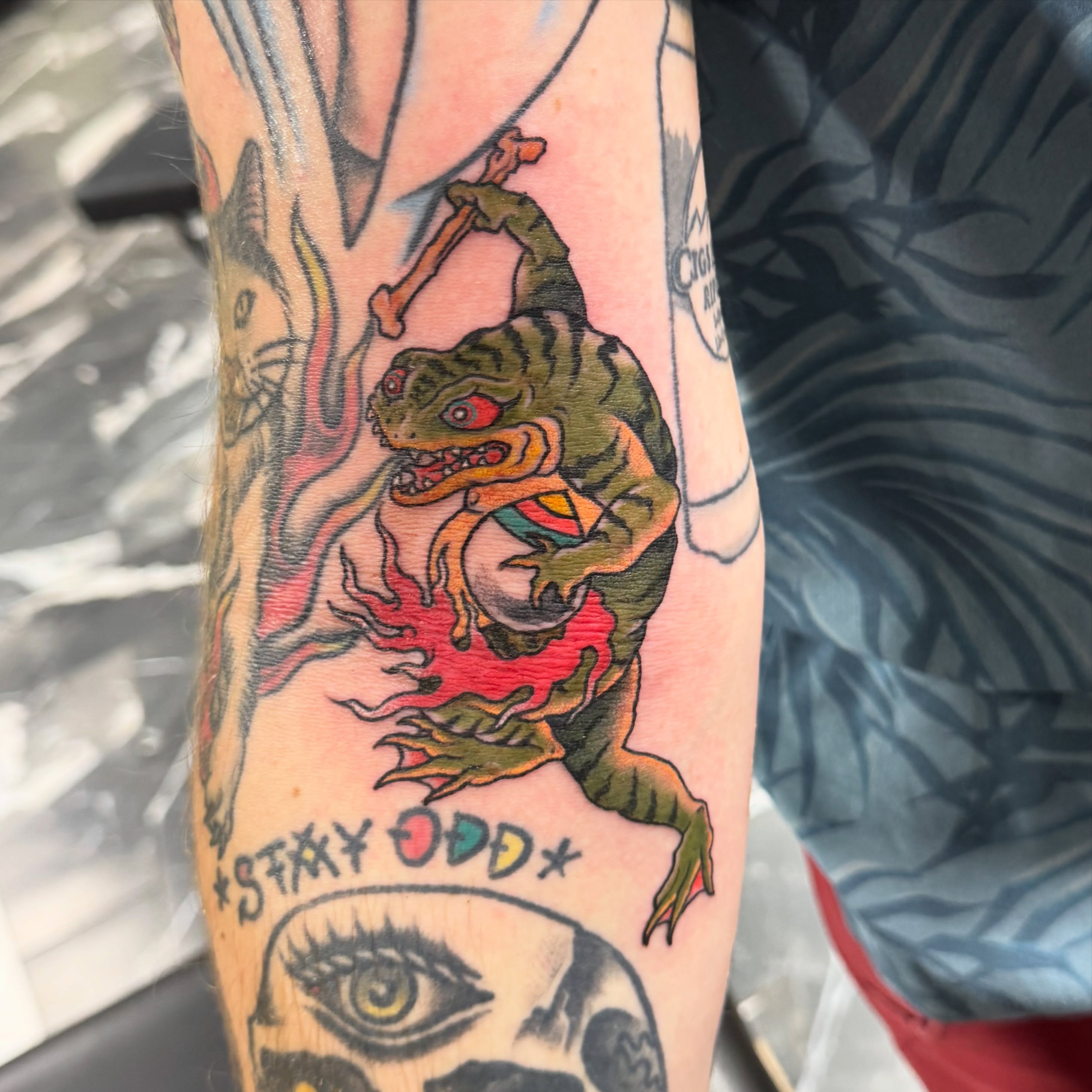 Dinosaur new school tattoo on the forearm by Jaxson Eugene Brady-Hobart