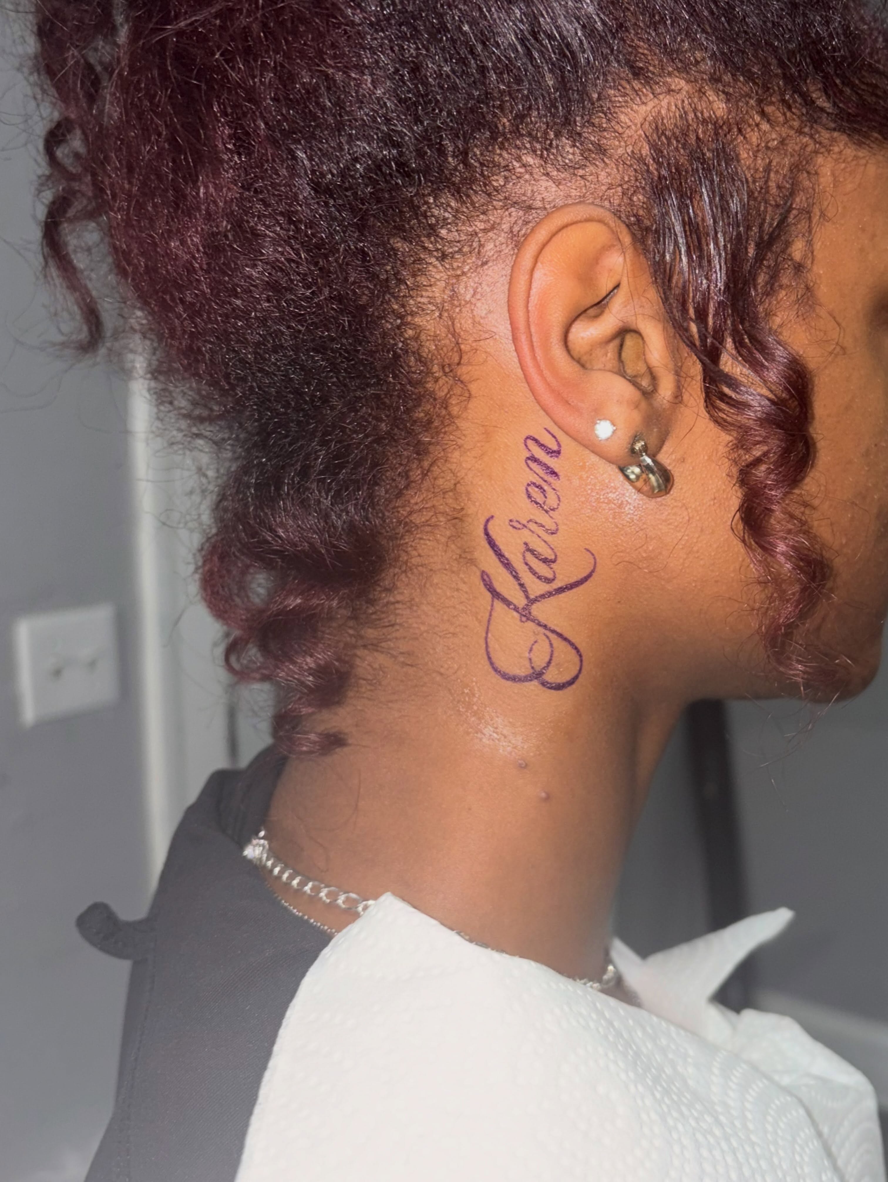Name tattoo lettering script tattoo on the neck by 216 Tattoos 🥰