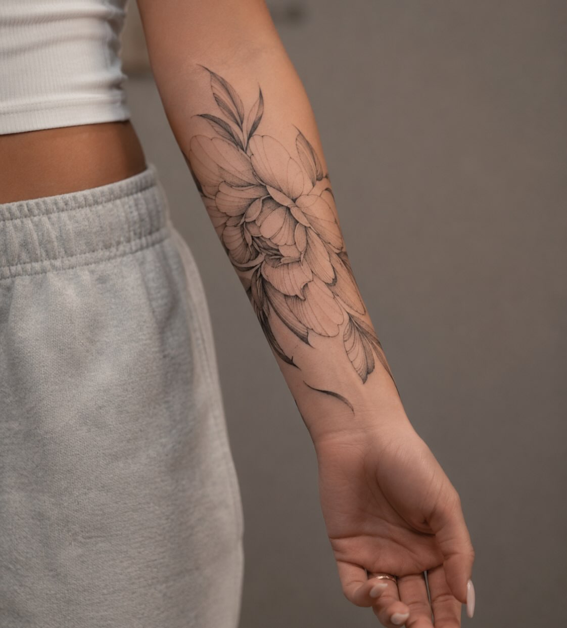 Floral black and grey tattoo on the forearm by ꜰɪɴᴇ ʟɪɴᴇ ᴛᴀᴛᴛᴏᴏꜱ