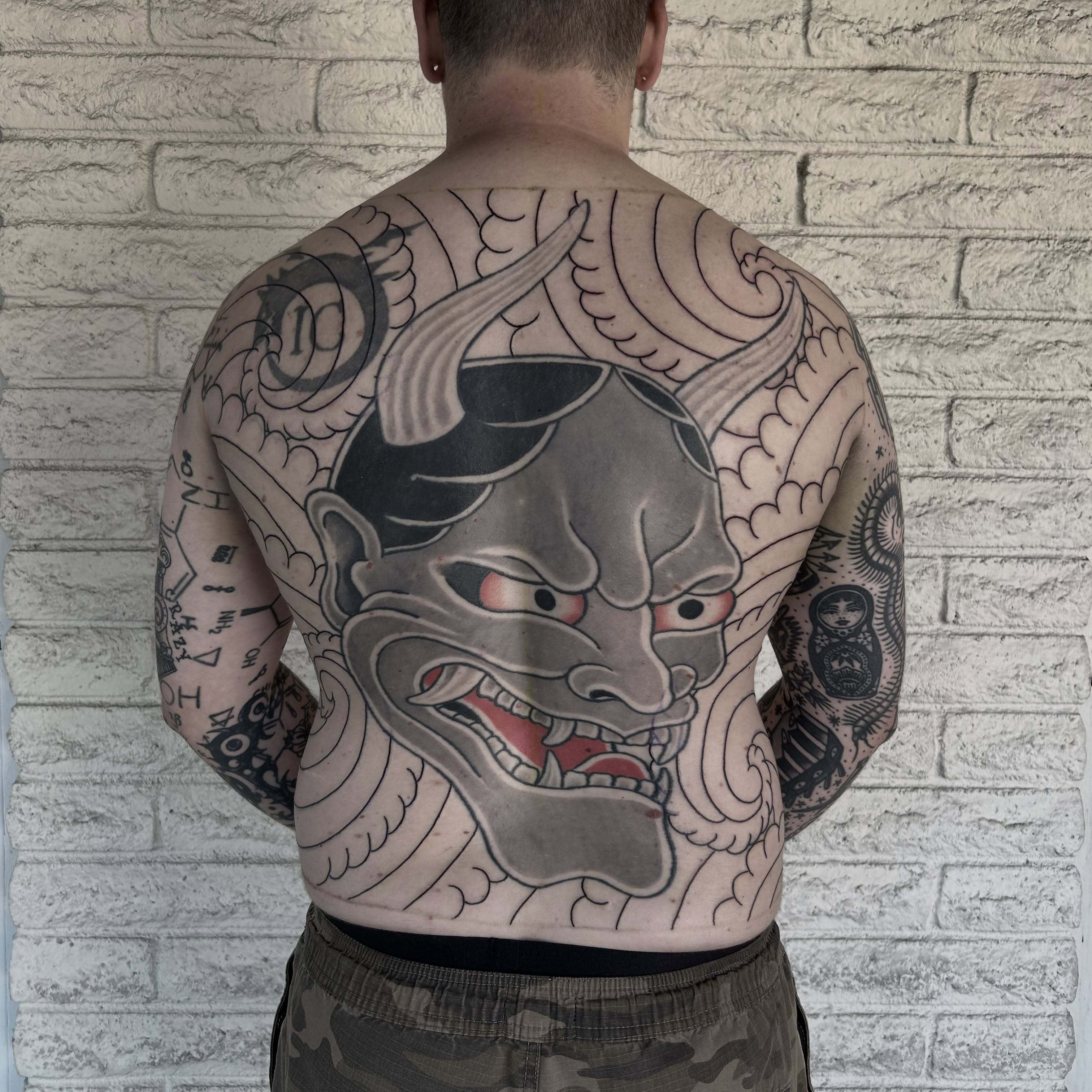Demon mask japanese irezumi tattoo on the back by Stephen Sanchez