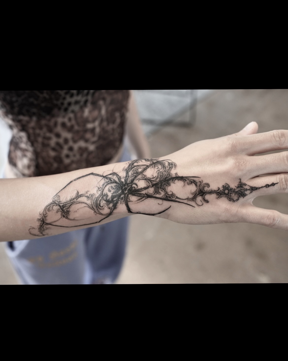 Abstract floral design black and grey tattoo on the forearm by @ashencoil