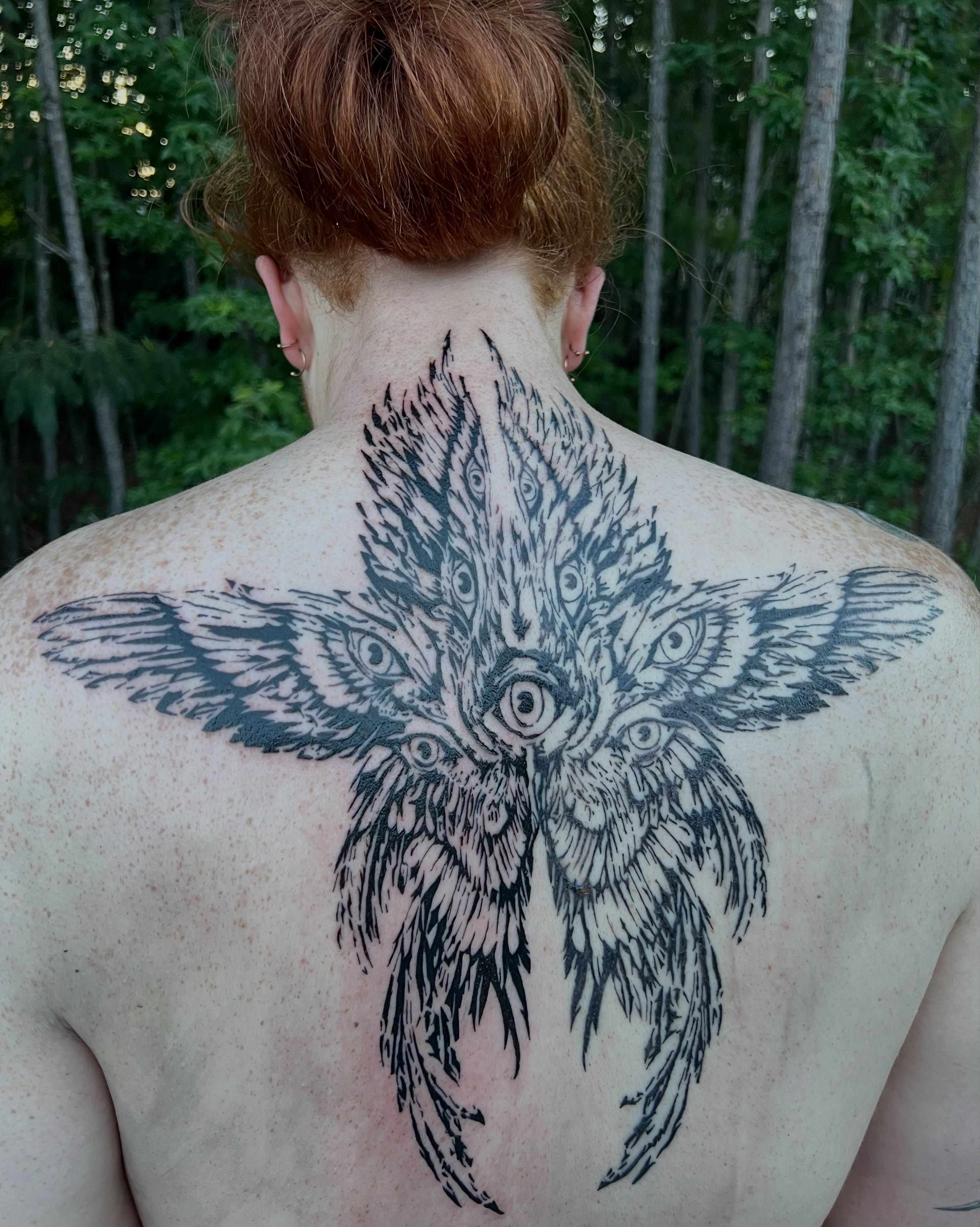Owl black and grey tattoo on the back by Adam