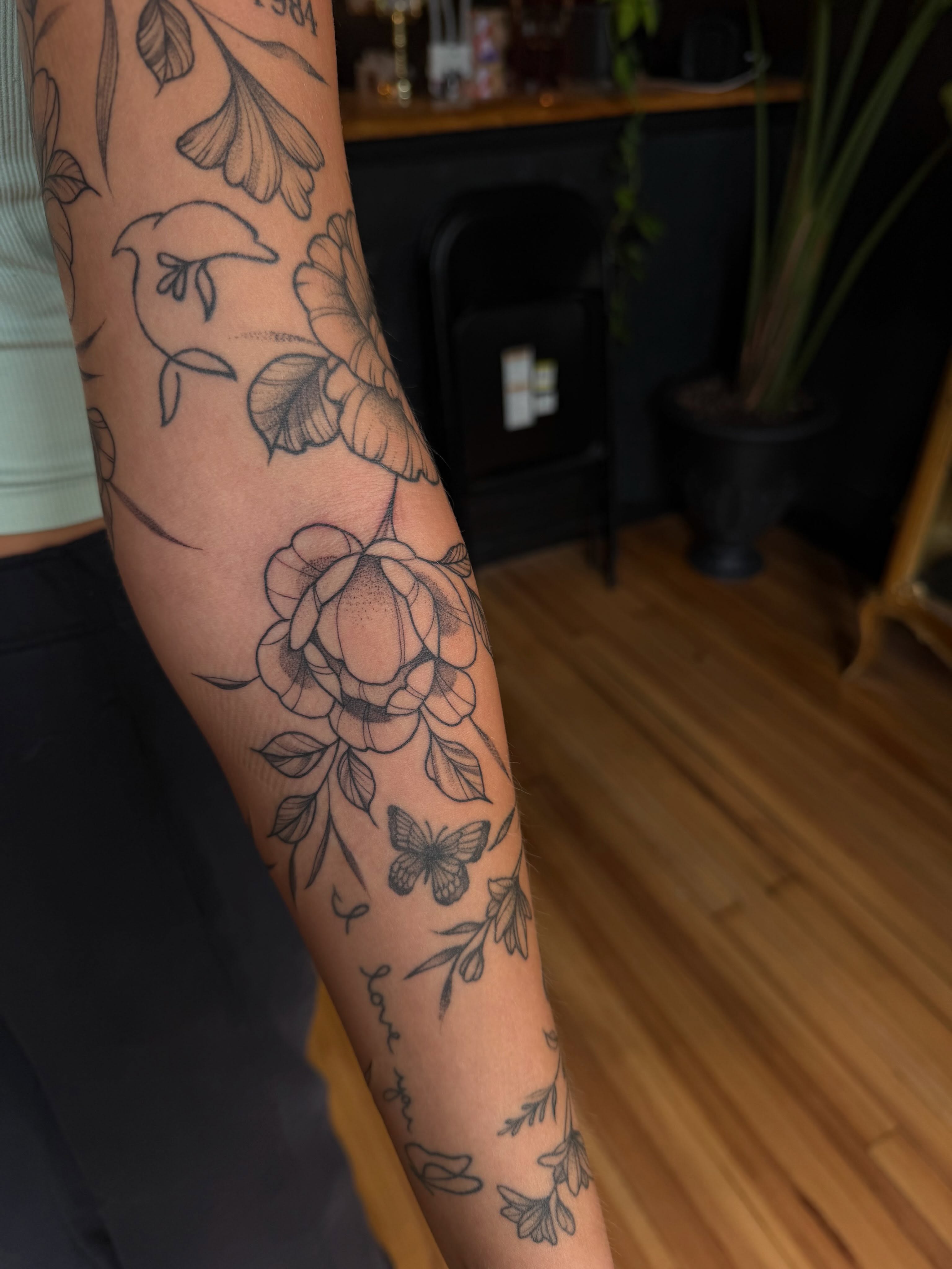 Floral bouquet dotwork tattoo on the forearm by Allison