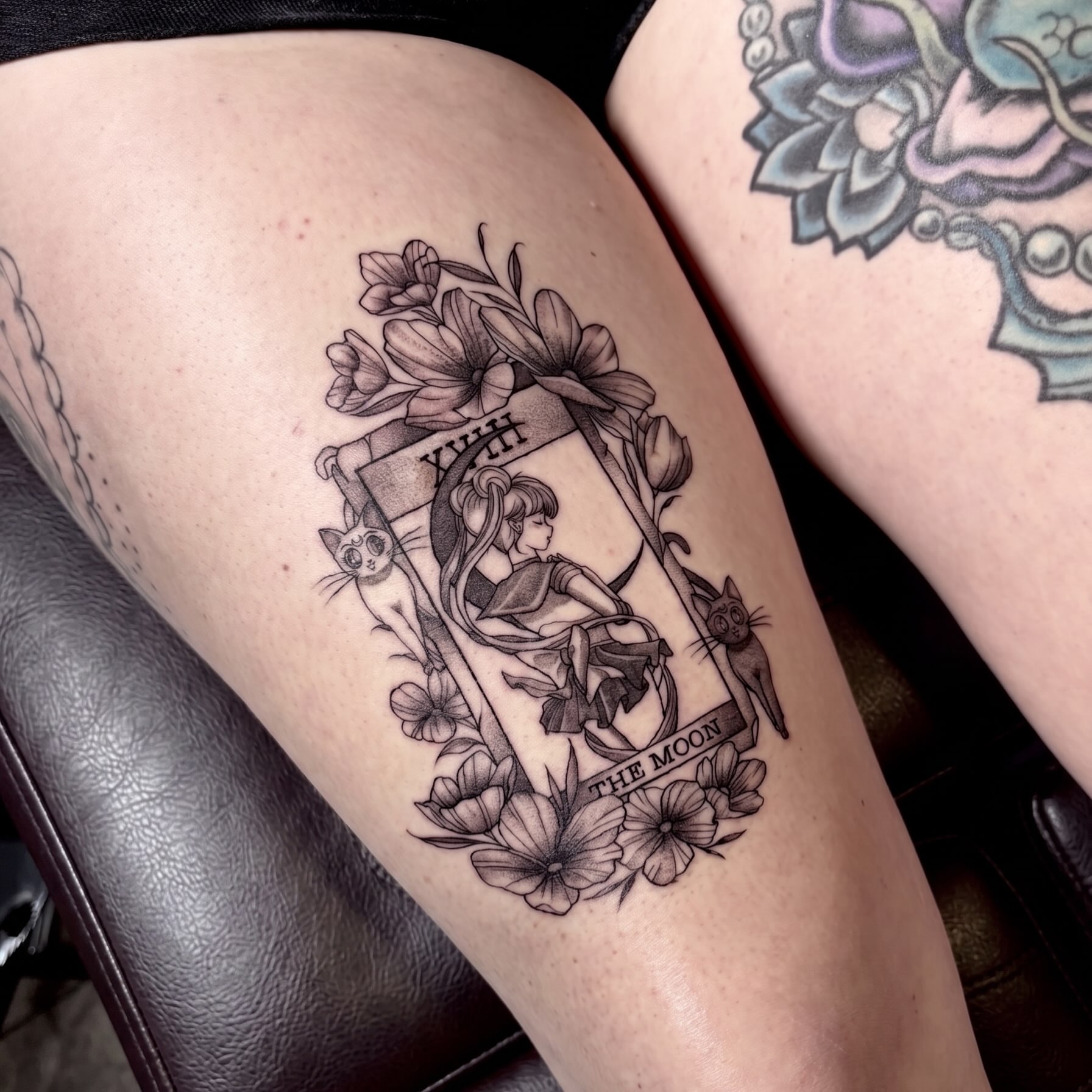 The moon tarot card black and grey tattoo on the thigh by Barbara Gonzalez