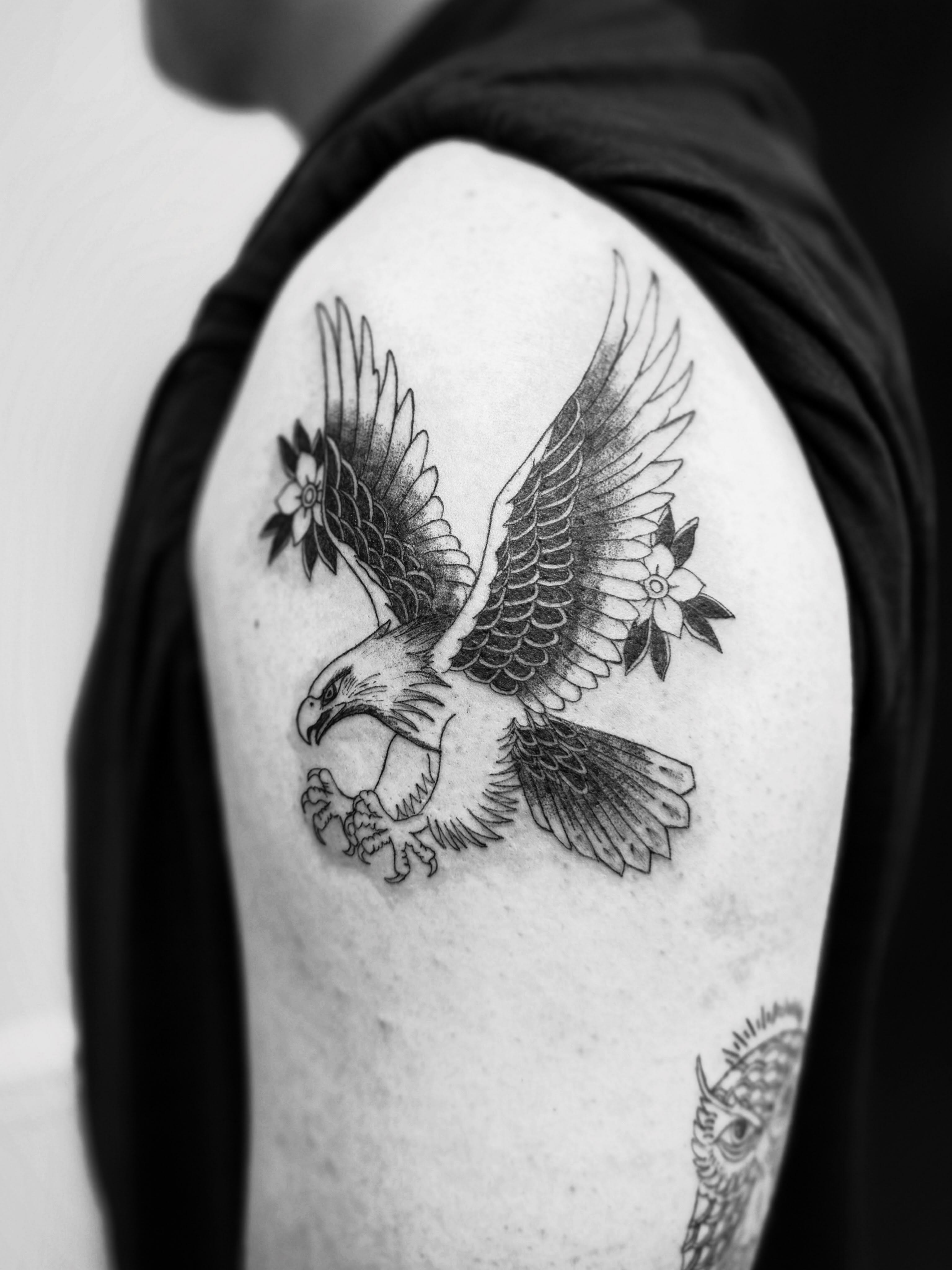 Eagle black and grey tattoo on the shoulder by Taylor Johnson