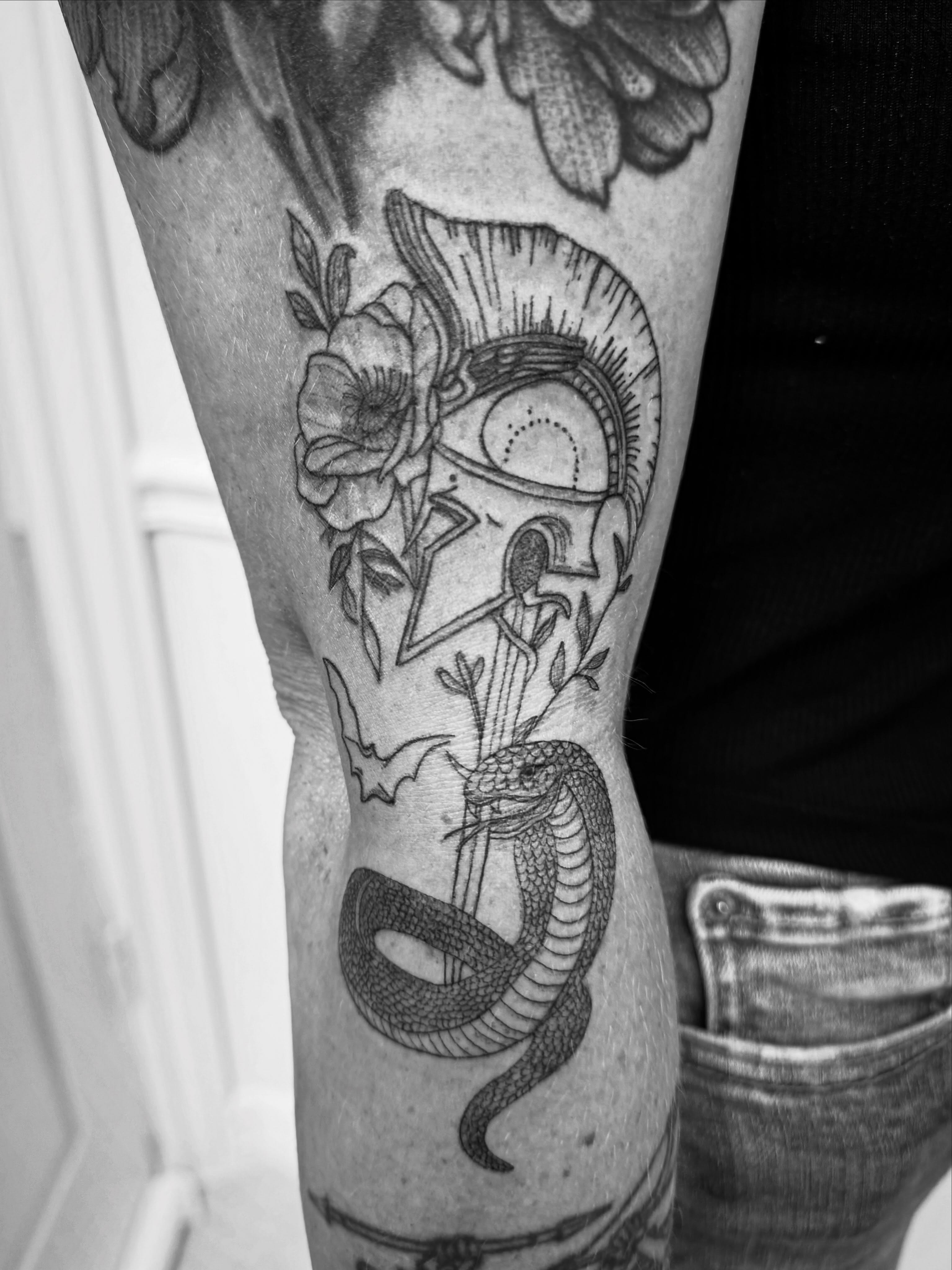 Skull and snake American traditional tattoo on the forearm by Taylor Johnson