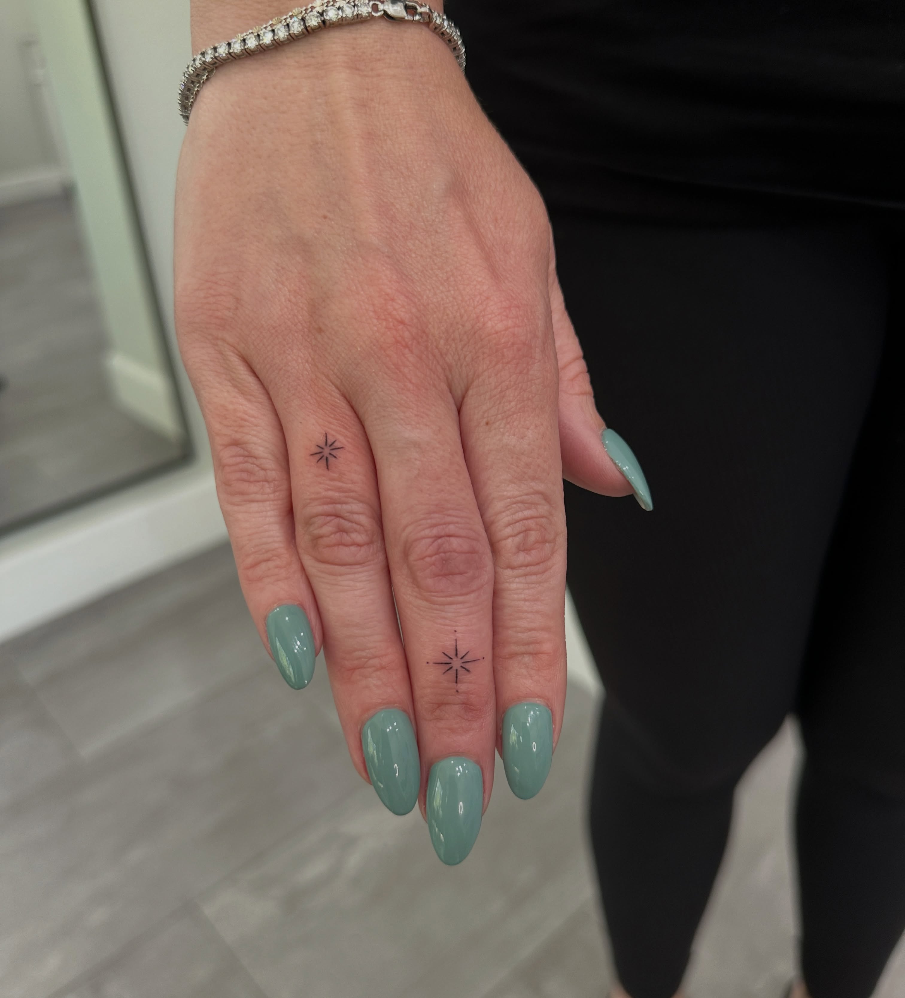 Star geometric tattoo on the hand by Alex